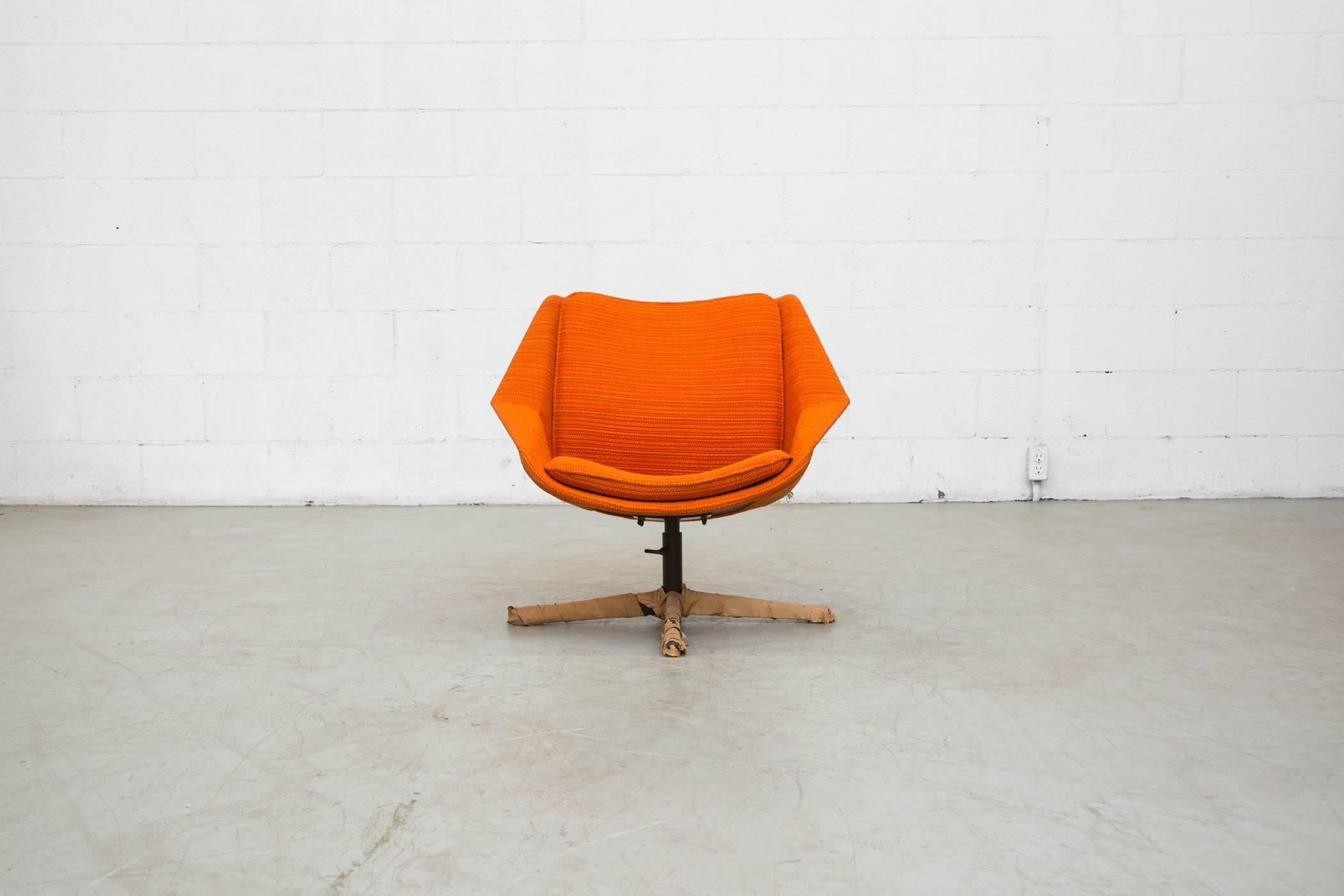Electric orange Pastoe swivel lounge chair with original factory wrappings and box. Never used.