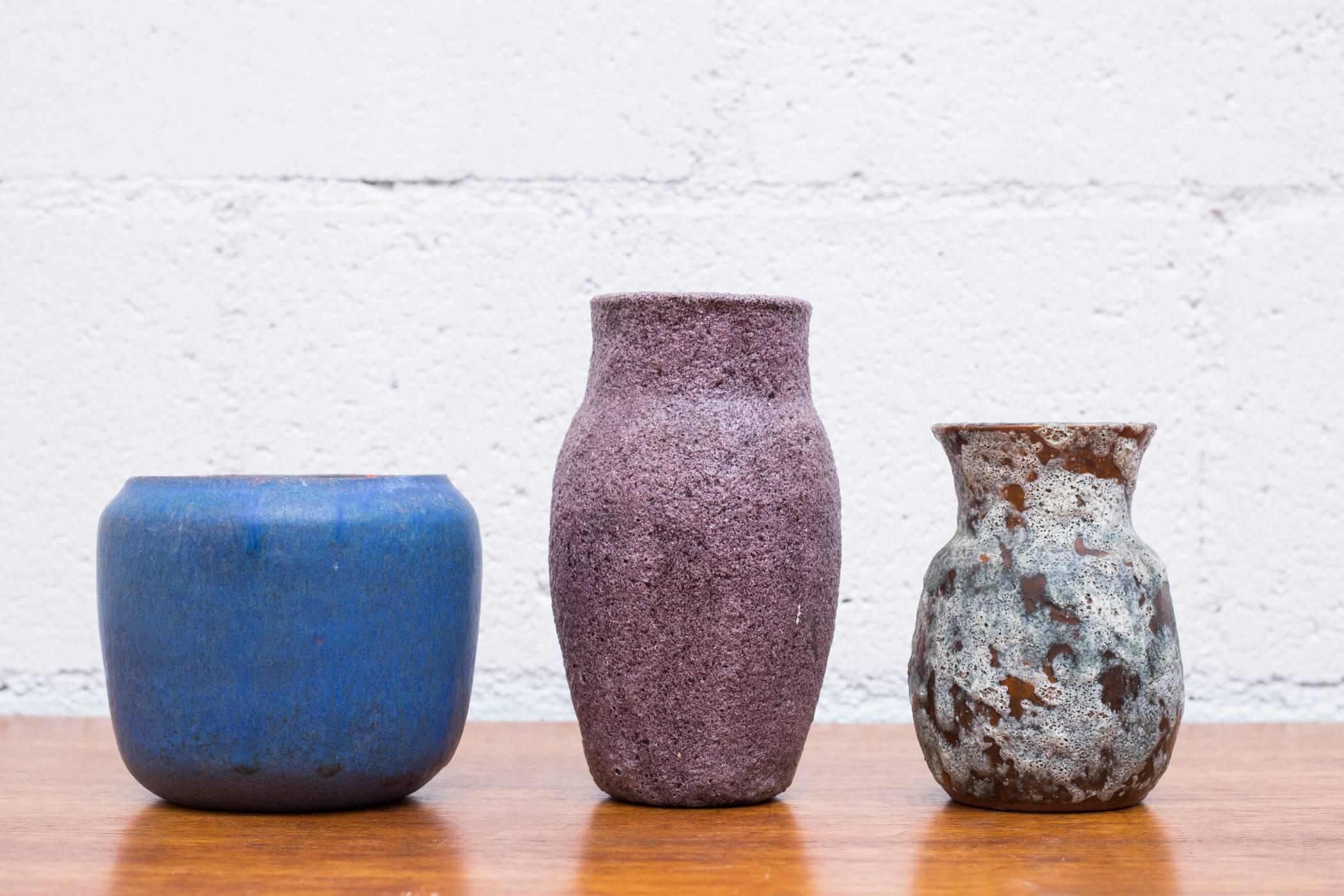 A lovely set of small vases that elegantly showcase the creative Boom Dutch ceramics went through in the middle of the last century. Forever looking for a different approach to ceramics companies like Vest Ceramics, Duifs Ceramics, Ravelli and