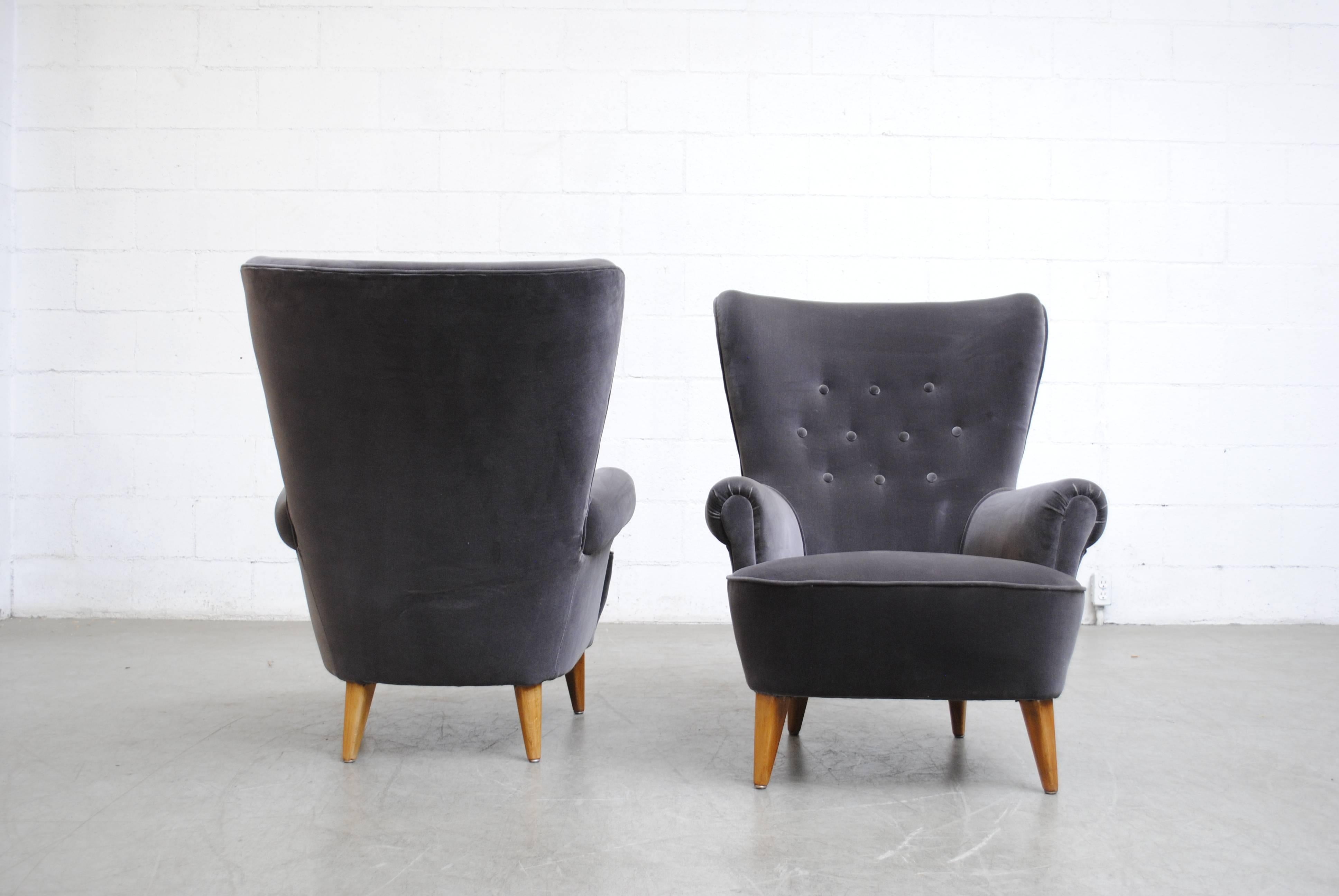 Pair of newly upholstered Theo Ruth lounge chairs in gorgeous seal grey velvet. Legs are lightly refinished. Set price. Other colors and style variations available (S507) listed separately.