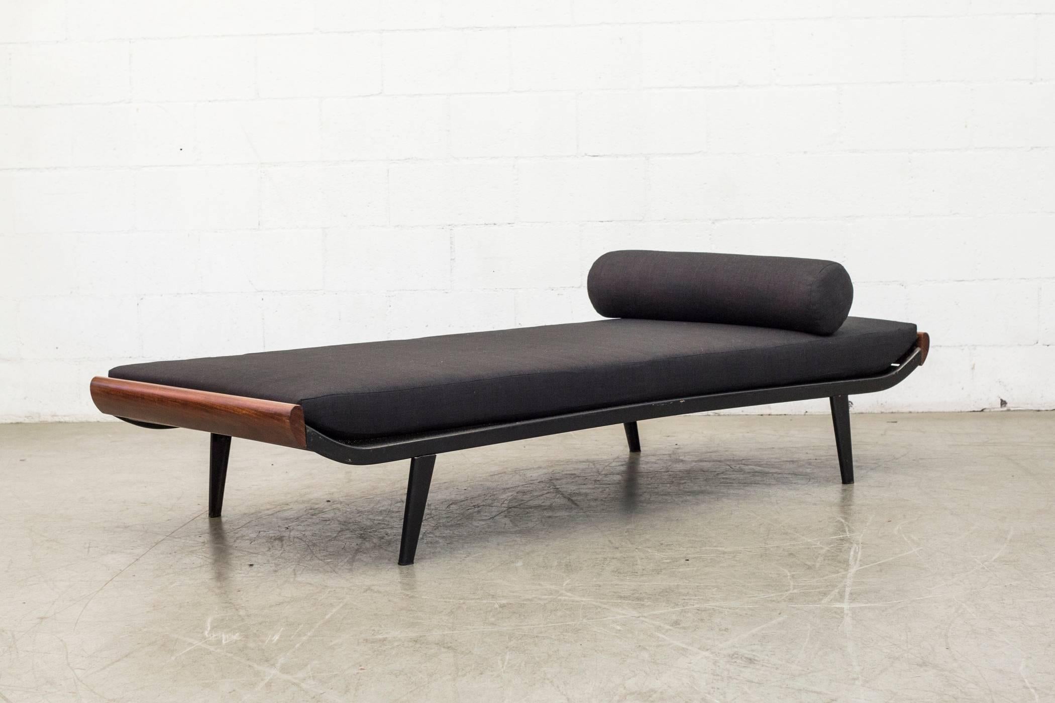 1950s-1960s Cleopatra daybed by A.R. Cordemeyer. Teak wood ends with enameled dark grey metal frame and 