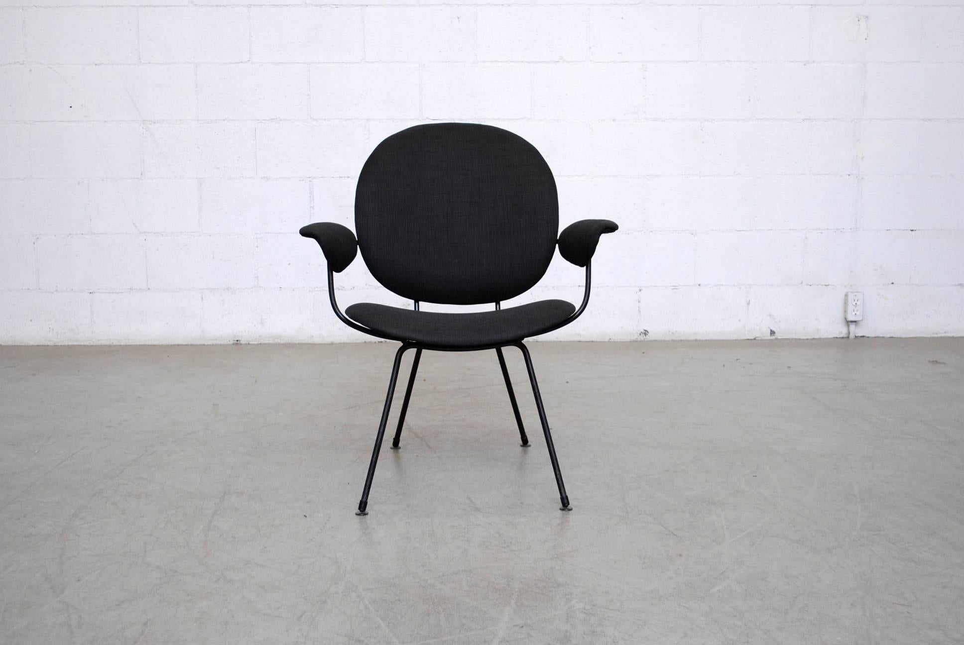 Lovely designed wire framed Kembo side chair with black enameled frame and upholstered seat, back and armrests.