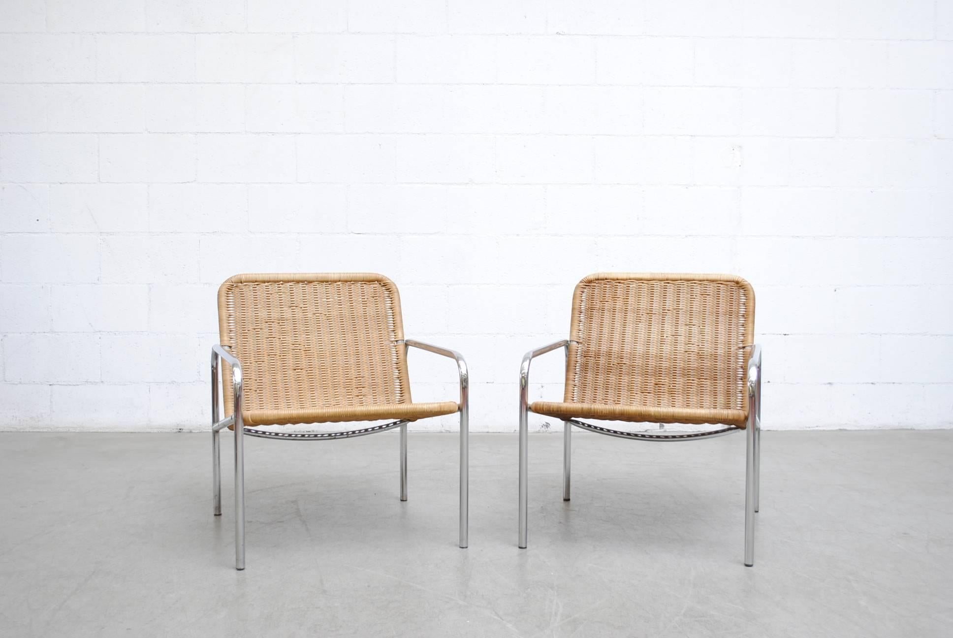 Low and handsome pair of chrome and woven rattan lounge chairs, possibly part of Visser's Osaka series. In good original condition with visible wear consistent with its age and usage.