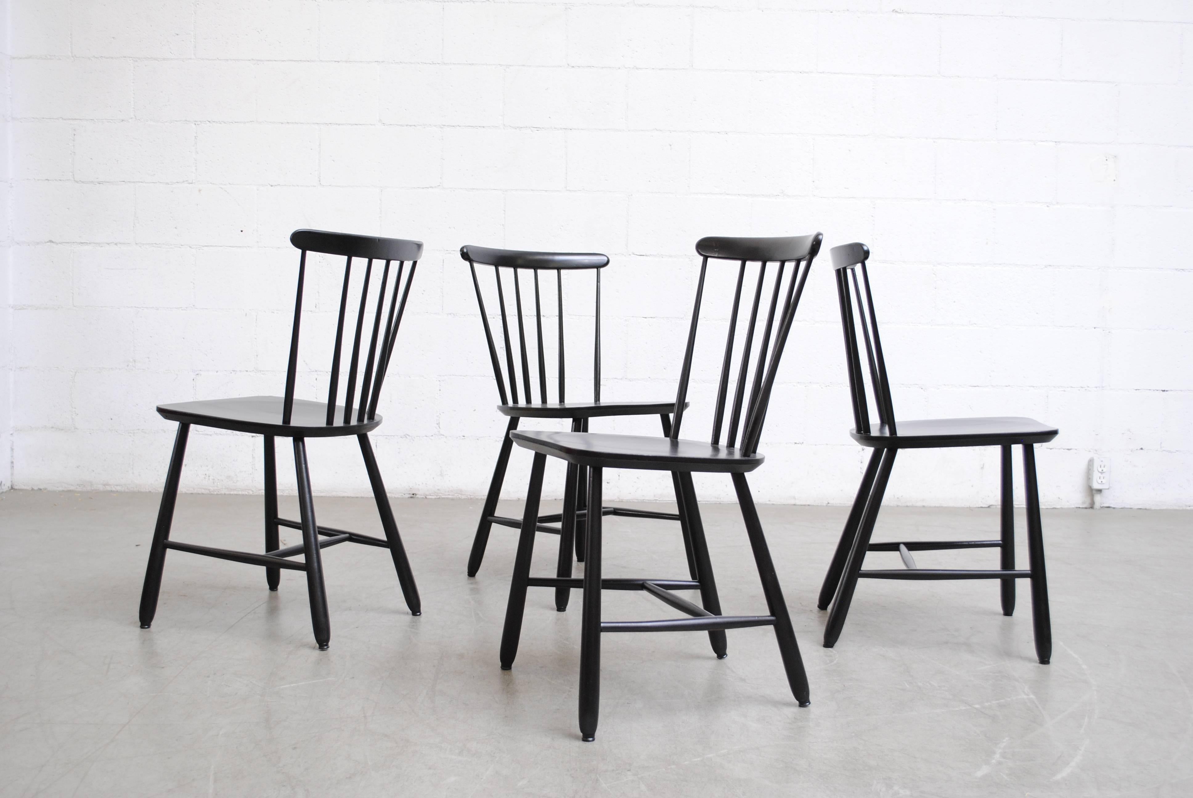 Beautiful black painted wood dining chairs with elegant ‘spindle back.’ Great condition.