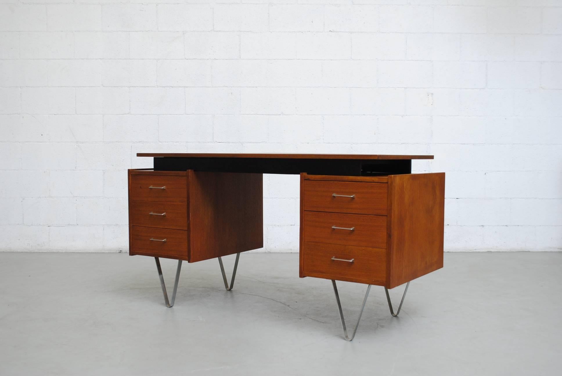 Rare Cees Braakman desk for Pastoe with thick hairpin legs. Side cabinet with sliding birch trays. Stellar and stylish. Good original condition. Minor wear consistent with its age and usage.