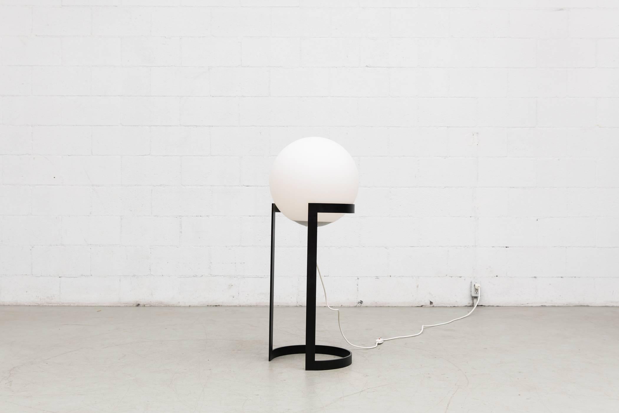 Newly powder coated black metal frame with original opaline milk glass globe and original hardware. The beautiful matte glass globe sits independently on the metal framed. Fabulous design. Good original condition.