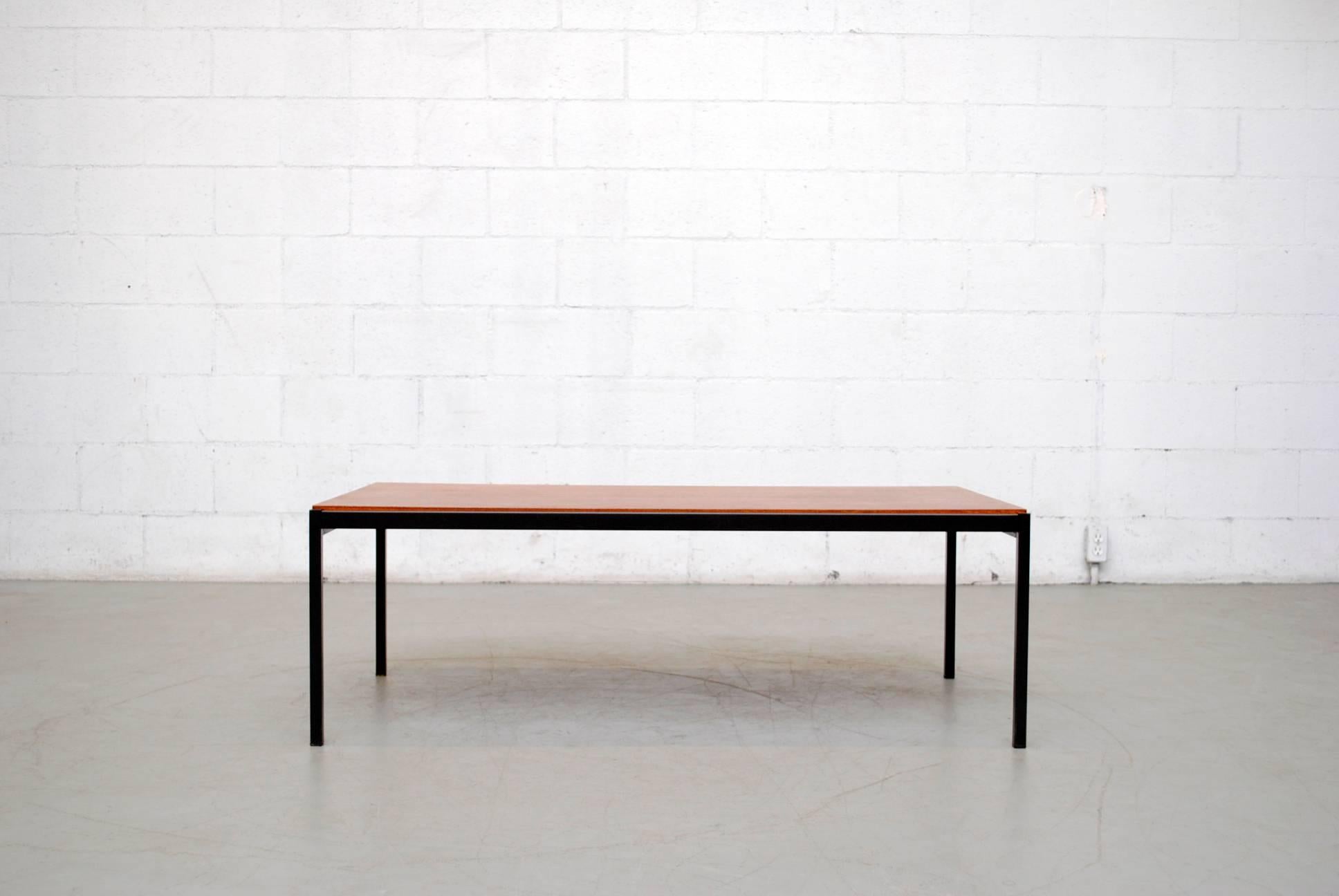 Handsome Architectural Coen de Vries teak and metal coffee table by Gispen with original top and black enameled metal frame. Visible wear, consistent to its age and usage. Well loved.