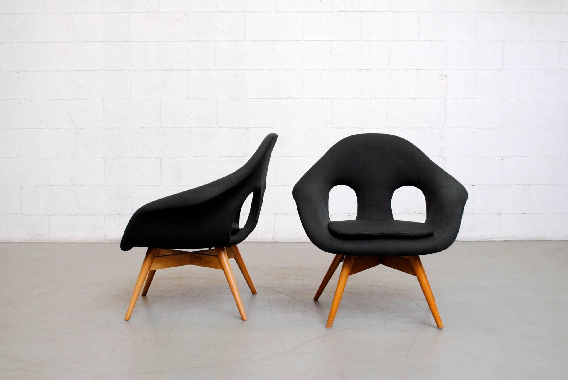 Pair of newly upholstered charcoal black bucket chairs by Miroslav Navratil frames are in good original condition. Other similar styles available in assorted colors (listed separately). Also available in original upholstery. Set price.
