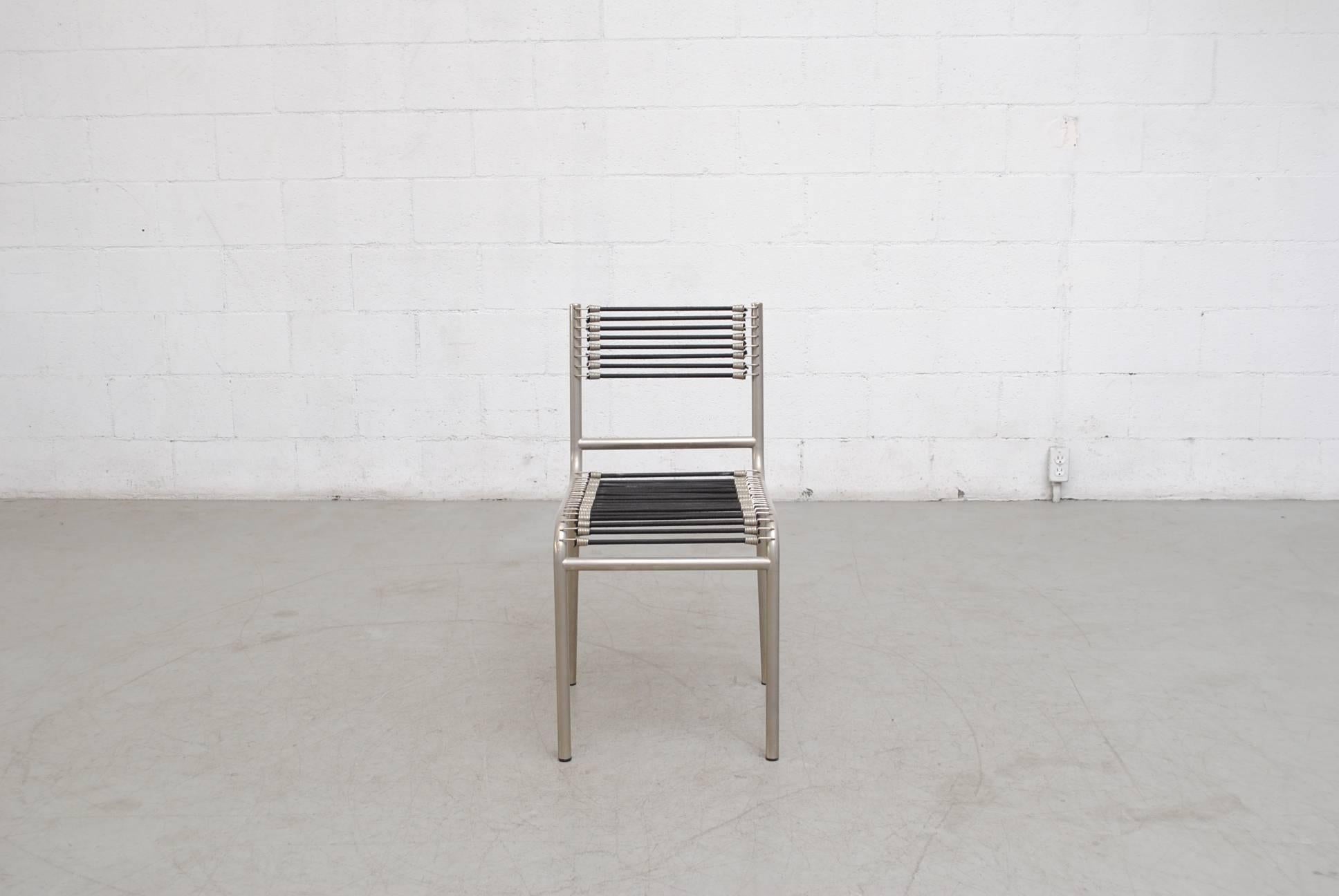This 1970s-1980s set of four sandows chair by René Herbst with nickel-plated frames and super cool bungee seats and backs was designed in 1928 and introduced at the Salon d' Automne in 1929. The design is part of the MoMa Collection. Set Price.