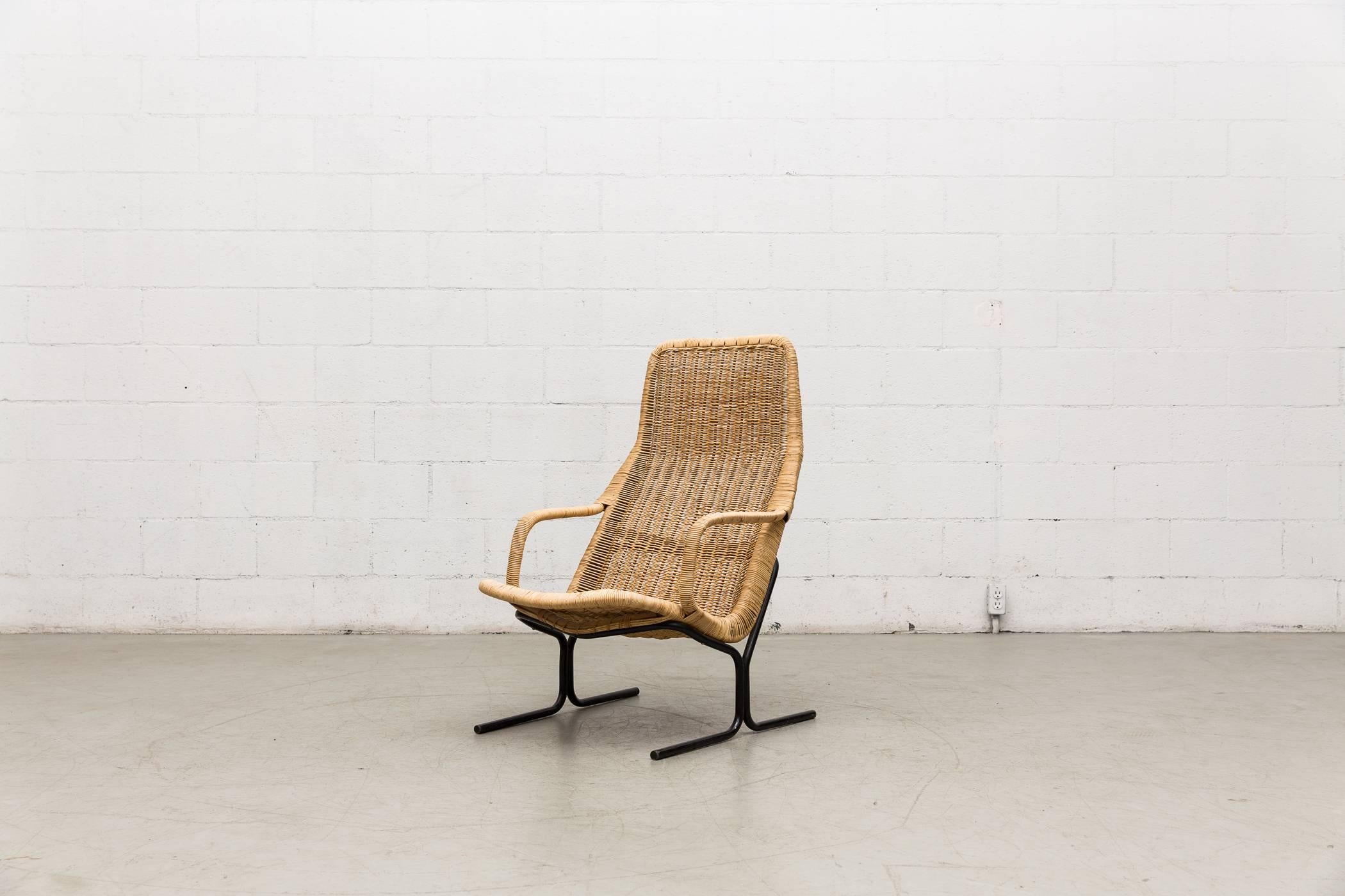 Special Dirk Van Sliedregt woven rattan high back armchair with black enameled metal frame and bamboo arm rests. Visible wear consistent with its age and usage. May have some rattan loss. 