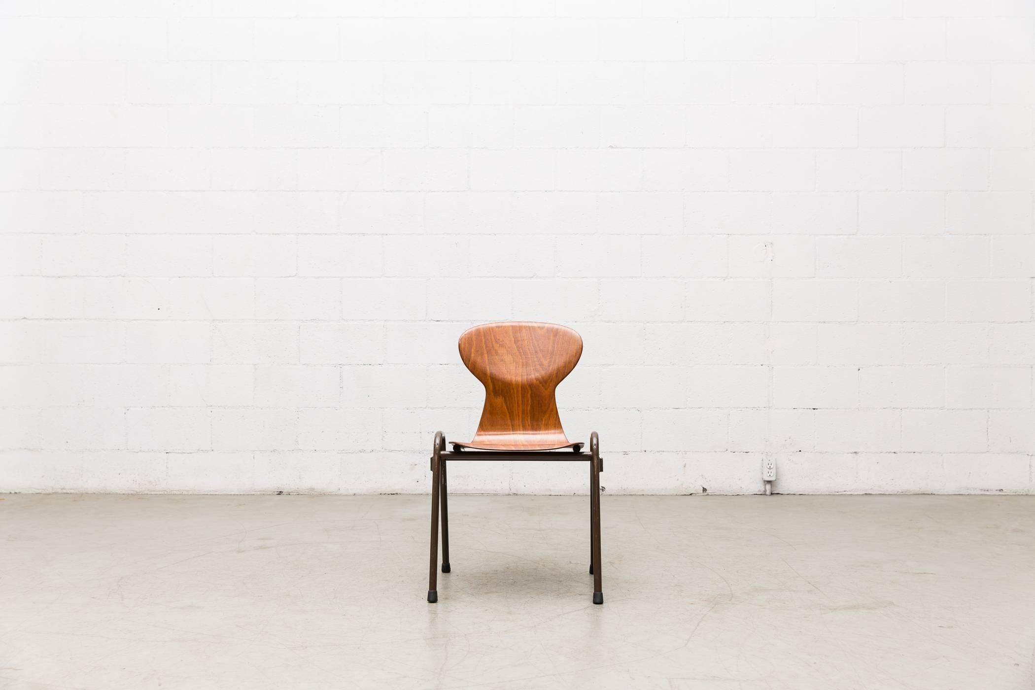 Mid-century, Fritz Hansen style auditorium chairs. This lot was originally used in a Dutch church. Design features single shell, pressed and bent teak slipper seats atop of a brown enameled metal tubular frame. Comes in two styles: With and without