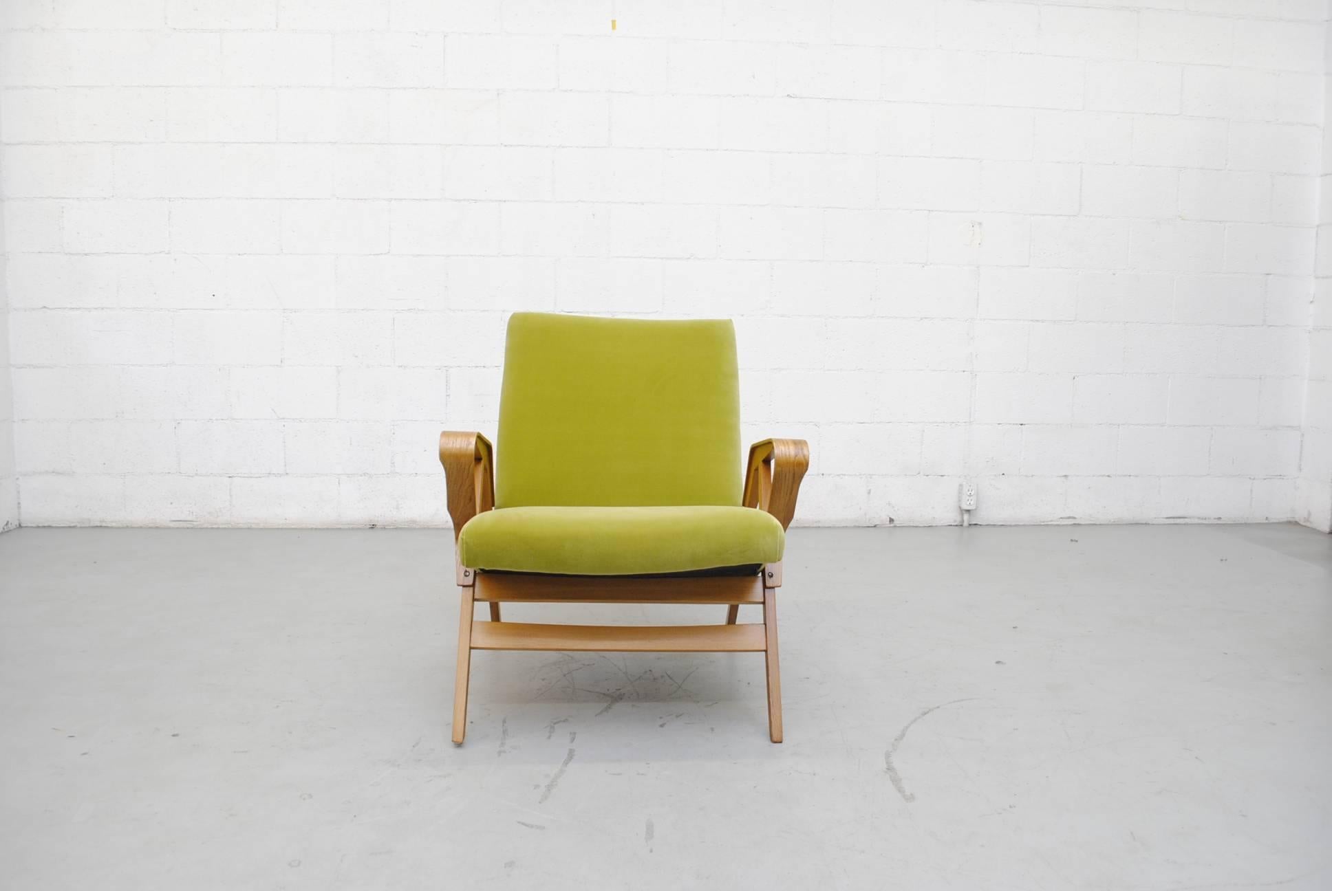Gorgeous Tatra lounge chair with bent beechwood frame. Elegantly curved armrests, 1960s Czechoslovakia. Newly upholstered in lime velvet. Frame in good original condition.