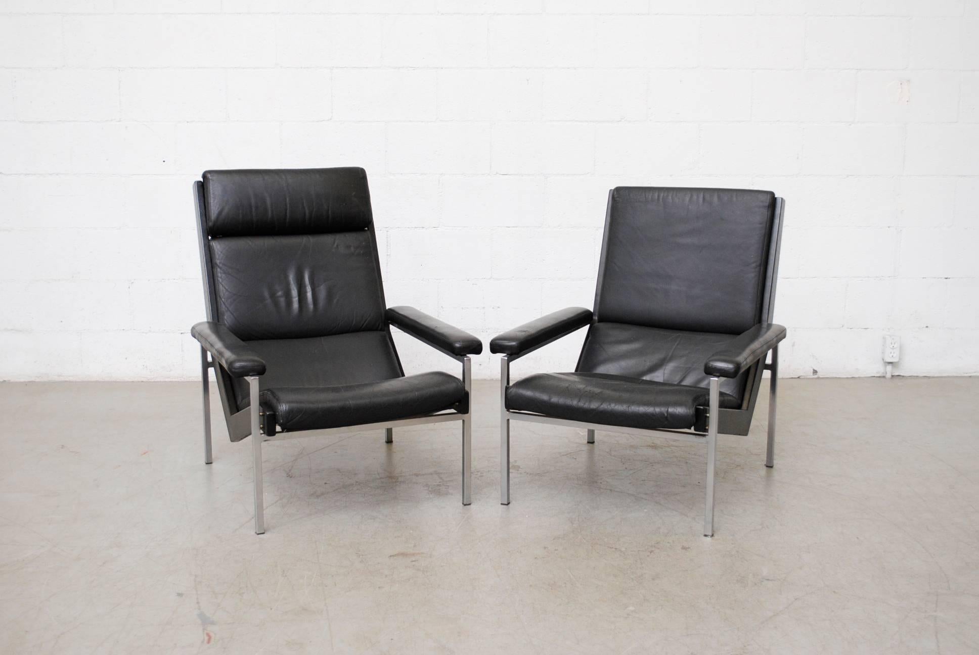Pair of 'His and Hers' Robert Parry armchairs with leather seats and chrome frames. Leather in worn condition with visible wear, cracking and patina. Frames in good original condition. Set price. Hers measures 28 x 37.75 x 15 / 33.5.