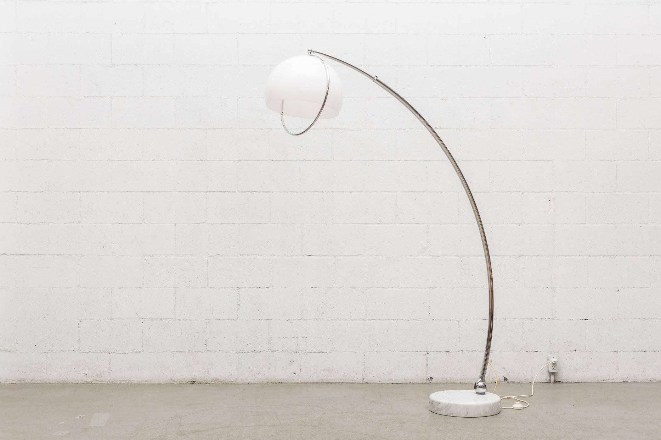 Large Arc lamp with heavy white marble base. Adjustable arc with chrome hardware and white plexiglass dome shade. Visible wear and tarnish to chrome. Marble in original condition. Two available.