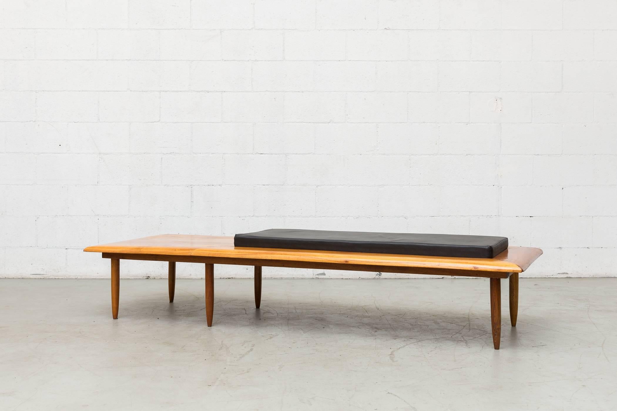 George Nelson style solid teak bench with black faux leather inset cushion seating. Gorgeous wood grain with glossy lacquered finish. Custom-made in the 1970s, Netherlands. Original condiiton.