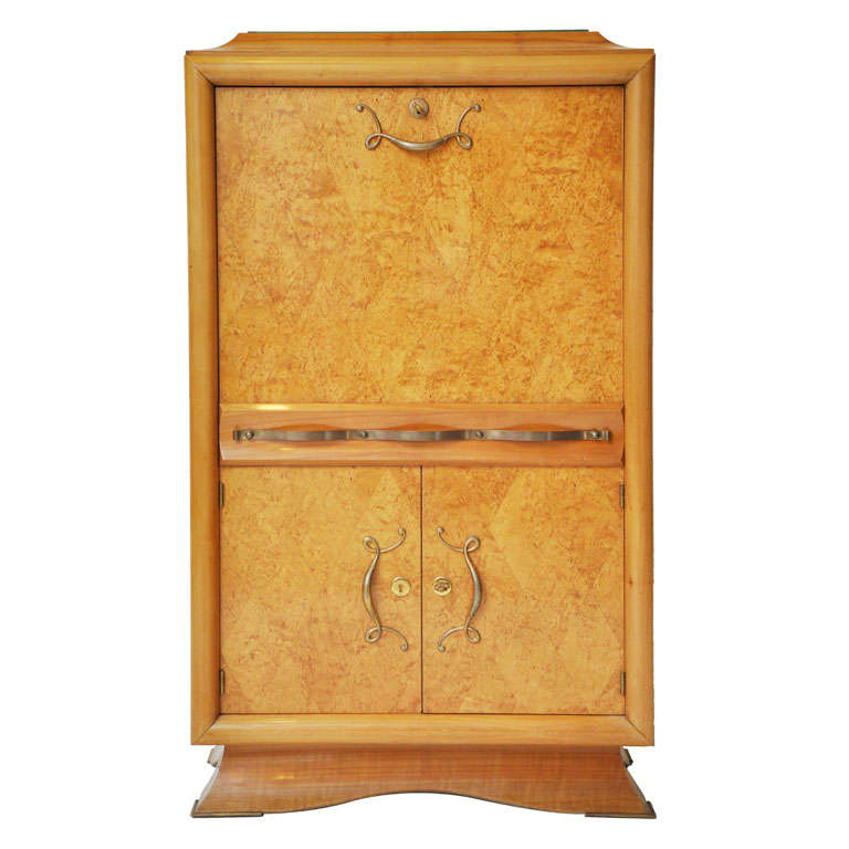 Rare French Art Deco golden burl Amboyna secretaire, in the manner of Jules Leleu, celebrated French interior designer, sculptor and furniture maker of the Art Deco period. This elegant cabinet is perfect for a desk, dry bar or bedroom cabinet. A