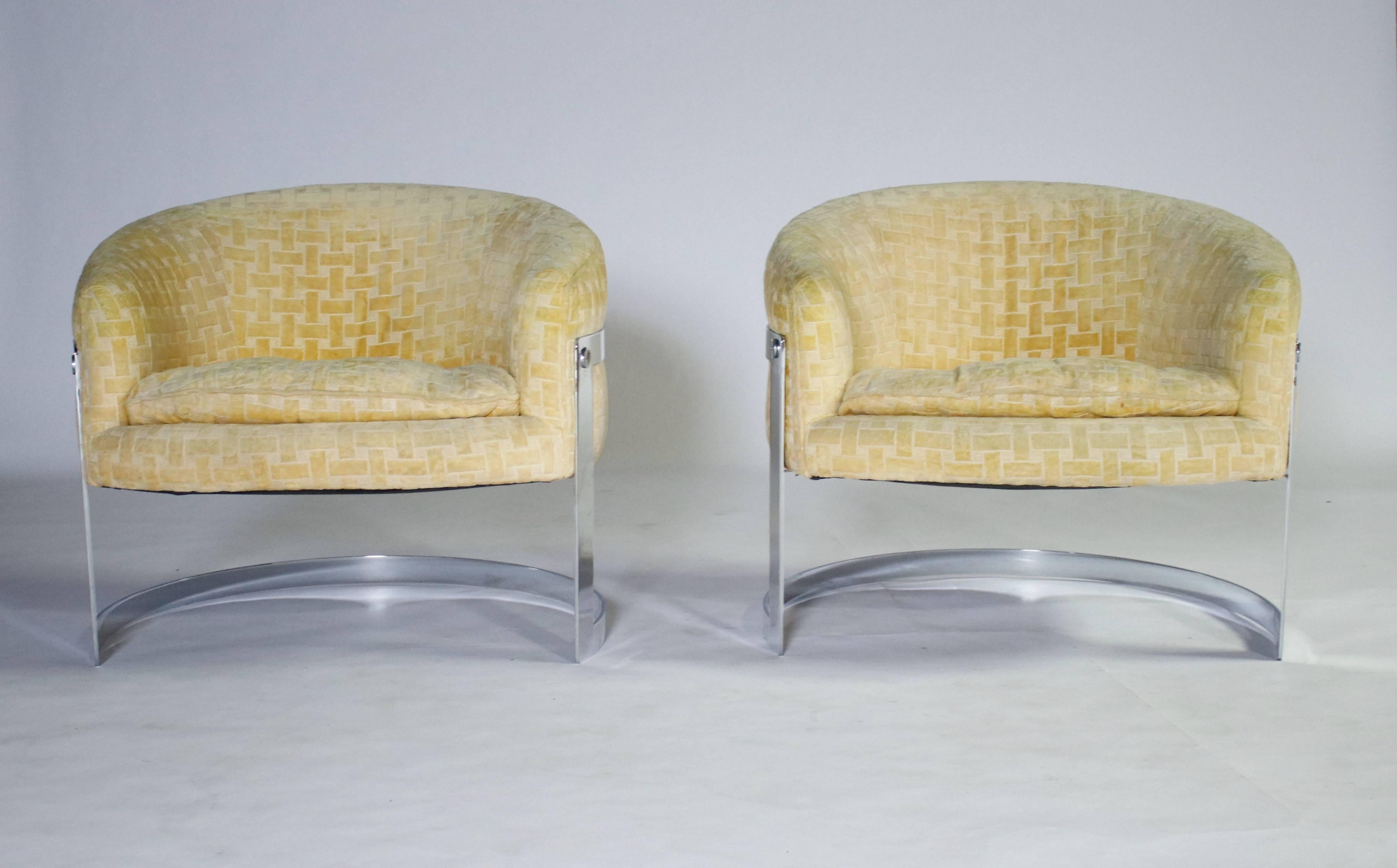 Milo Baughman chrome cantilevered barrel chairs in original yellow patterned fabric and removable cushions. Chrome in excellent condition and all screw heads intact. Chairs are very sturdy and good as is or reupholstered in your choice of fabric.