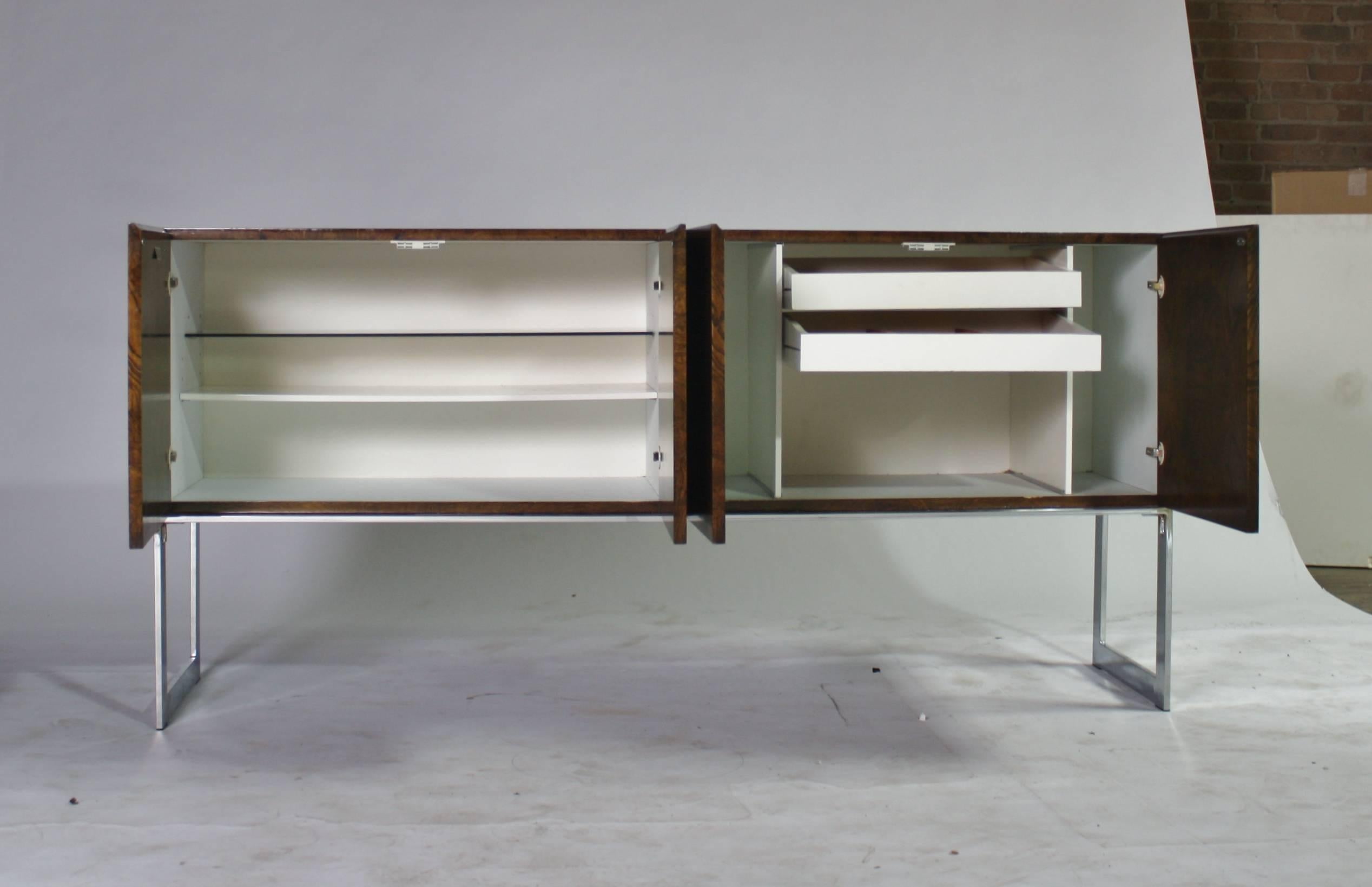 Signed Milo Baughman sideboard or credenza labelled, Thayer Coggin in the rare walnut burl wood floating on chrome legs. Four cabinet doors open to a white wood interior with two gold felt lined cutlery drawers on the right and shelving on the left