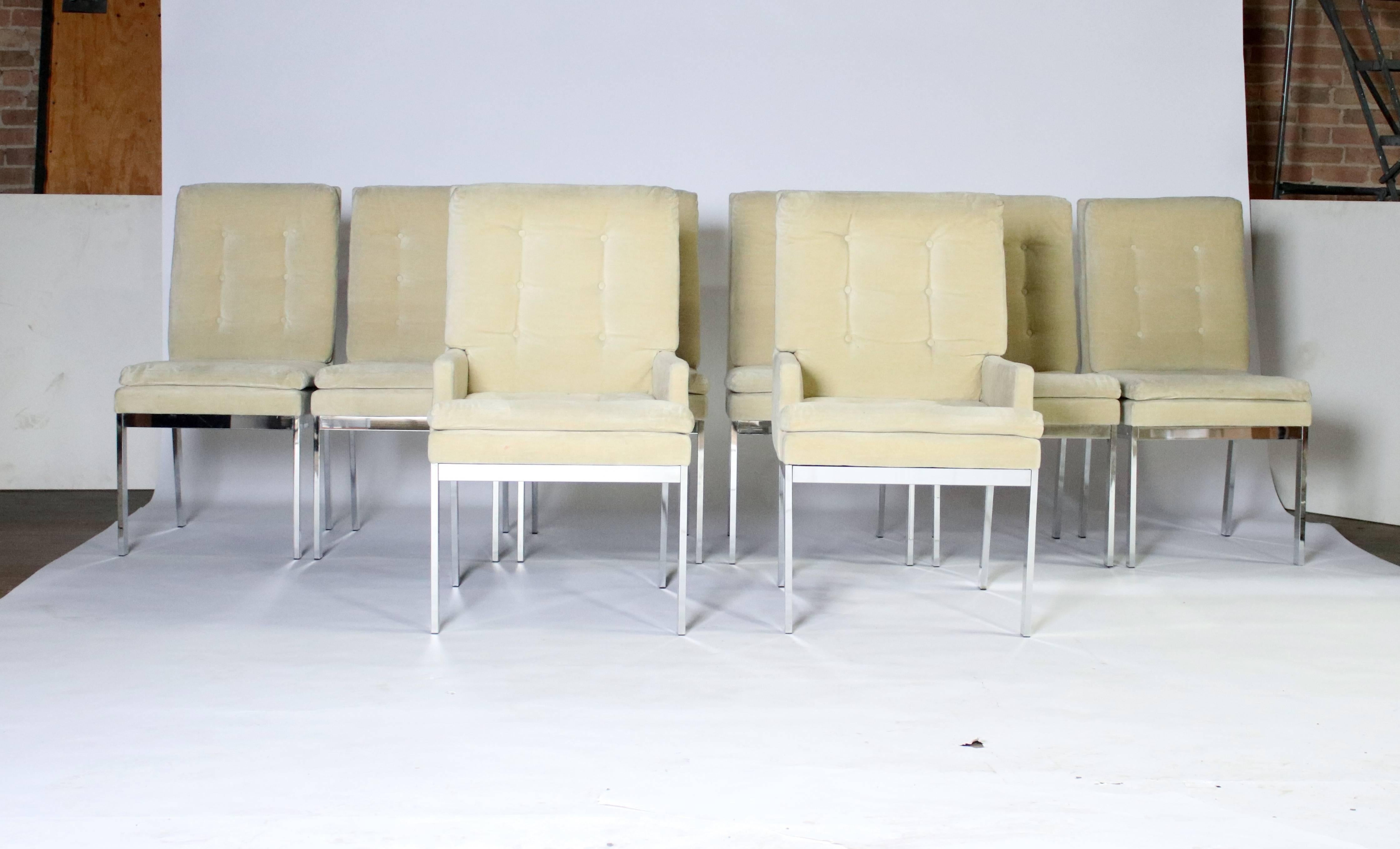 1970s chrome frame dining chairs with champagne color tufted upholstery. Very clean chrome and fabric with very little signs of age. All rubber glides intact and labels underneath the chair.
Set includes two armchairs and six side