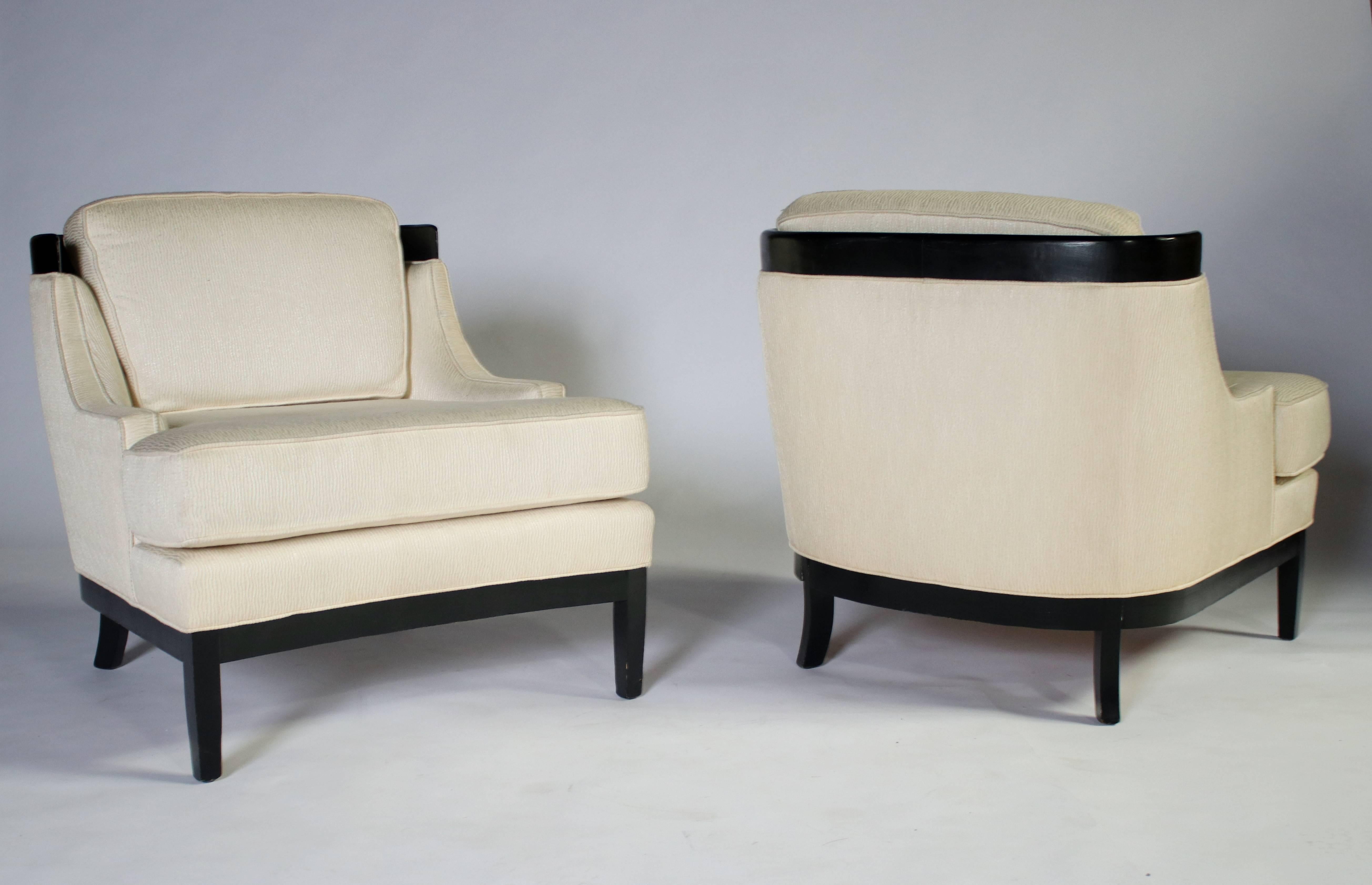 Classic pair of 1960s Hollywood Regency lounge chairs by Erwin-Lambeth. Black lacquered wood frame and upholstered in a cream textured fabric. Removable cushions in excellent vintage condition with age appropriate wear.