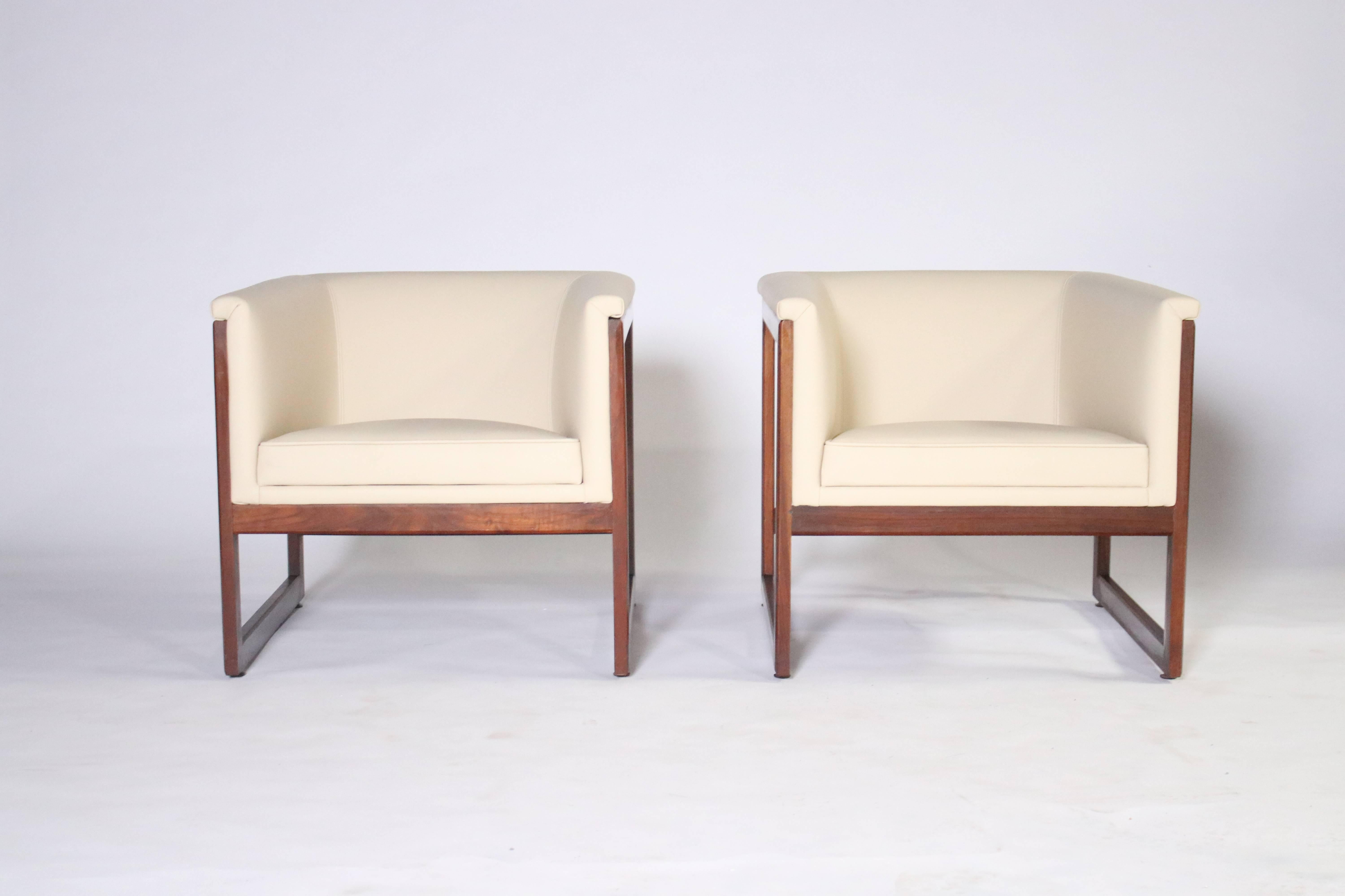 Pair of 1960s Milo Baughman floating or cantilevered cube shaped club chairs with solid walnut frames, newly upholstered in bone color leather.