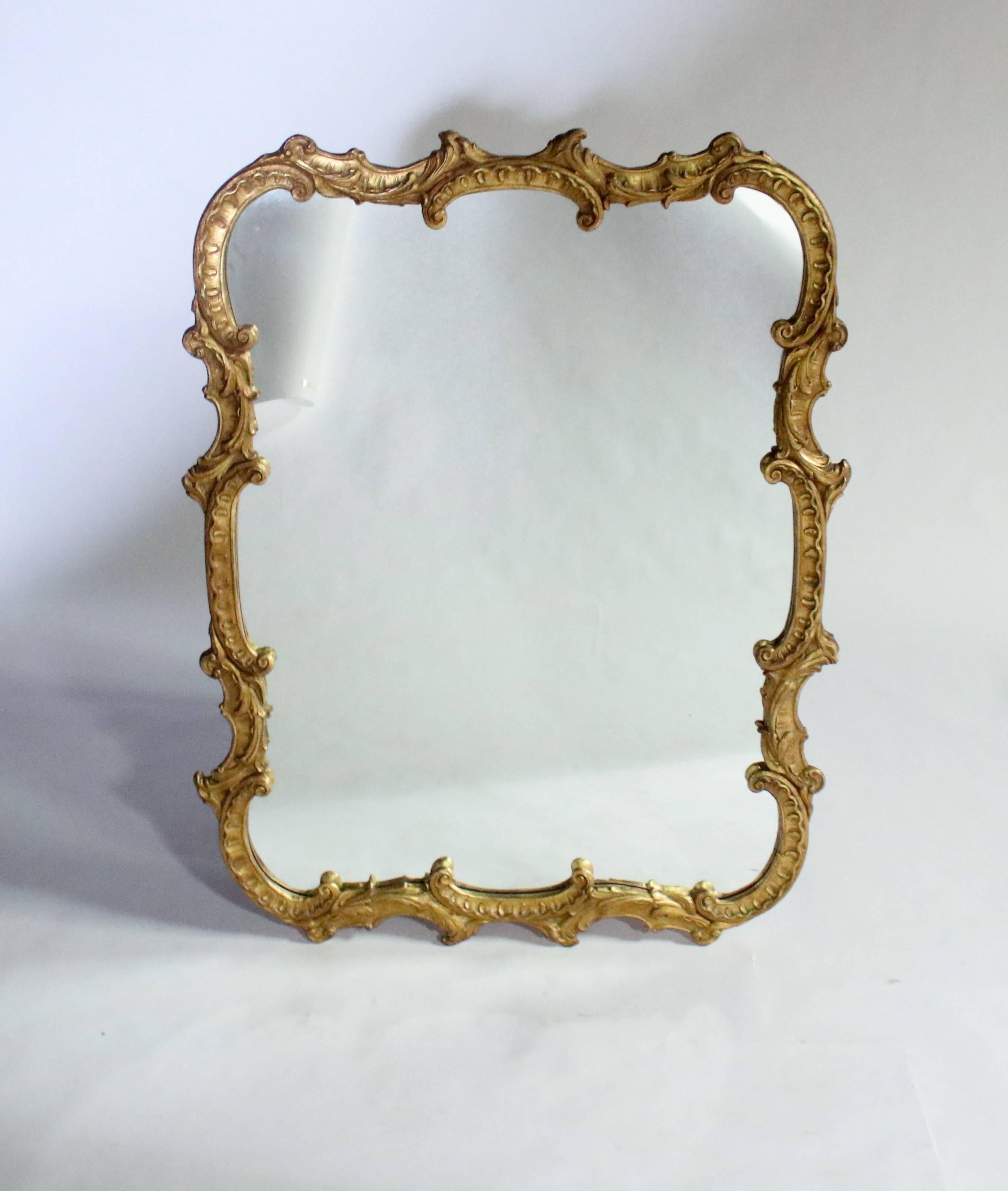 Early 20th century antique Georgian-style ornate mirror with carved plaster scrolls and wood backing. Ready to hang vertically or horizontally. Possibly Italian made.