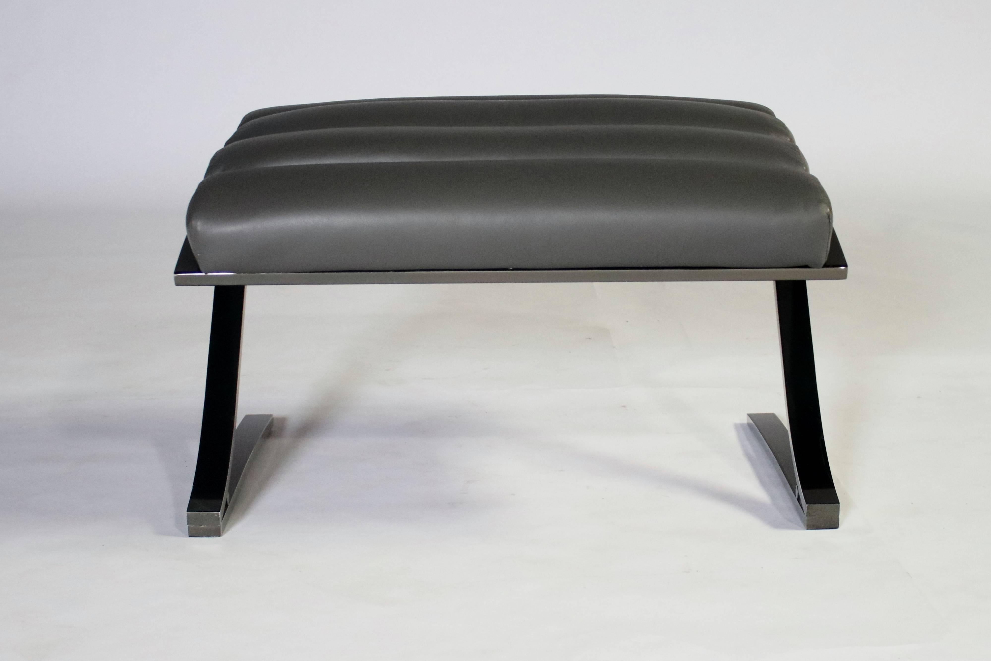 A cantilevered channeled gray leather lounge chair on a smoky- gray polished steel frame with ottoman by Design Institute of America. All newly upholstered leather and steel in excellent condition.
Chair measures 32