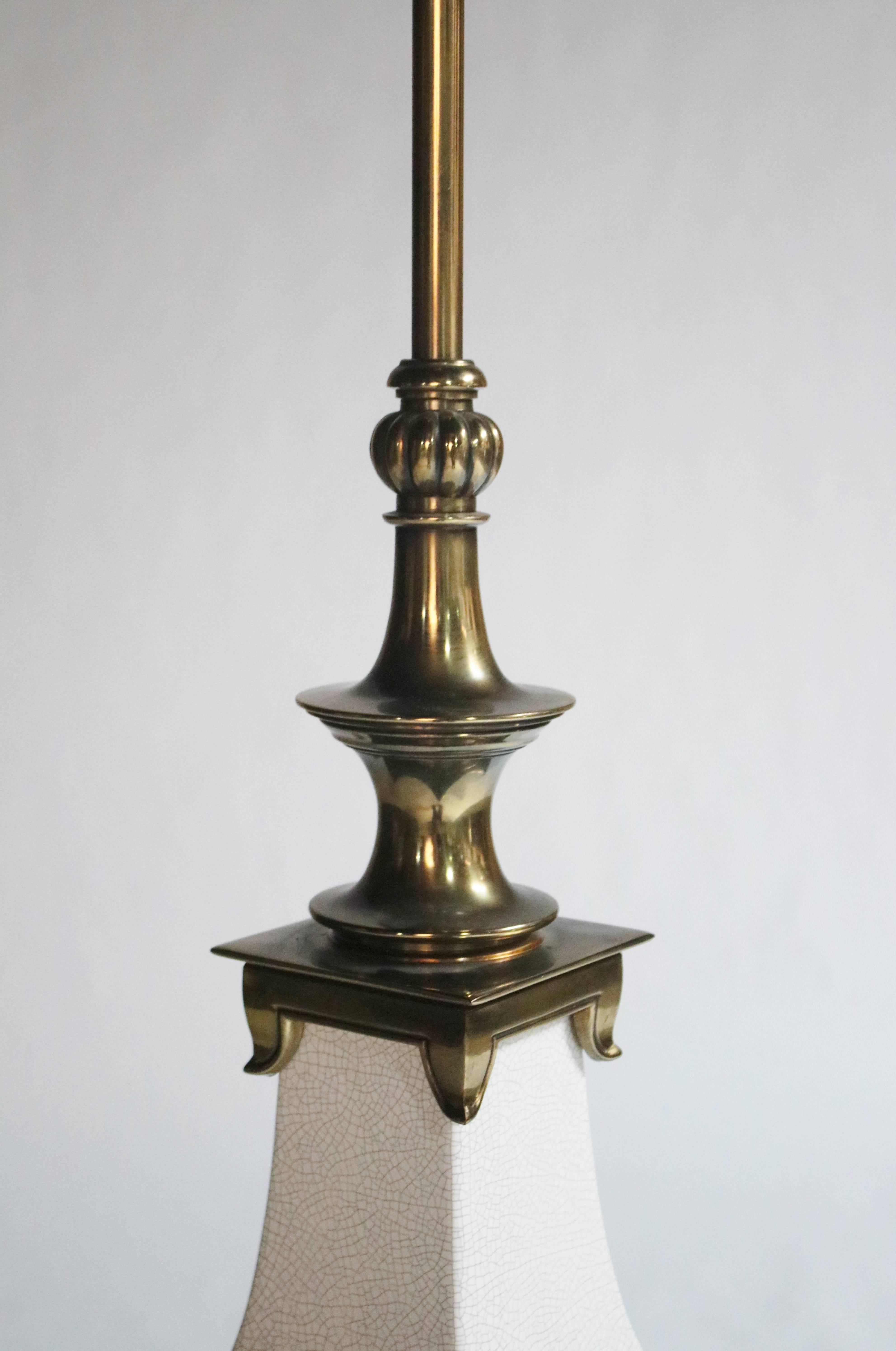 Asian style lamp made of white ceramic crackle glaze and brass details by Stiffel.
