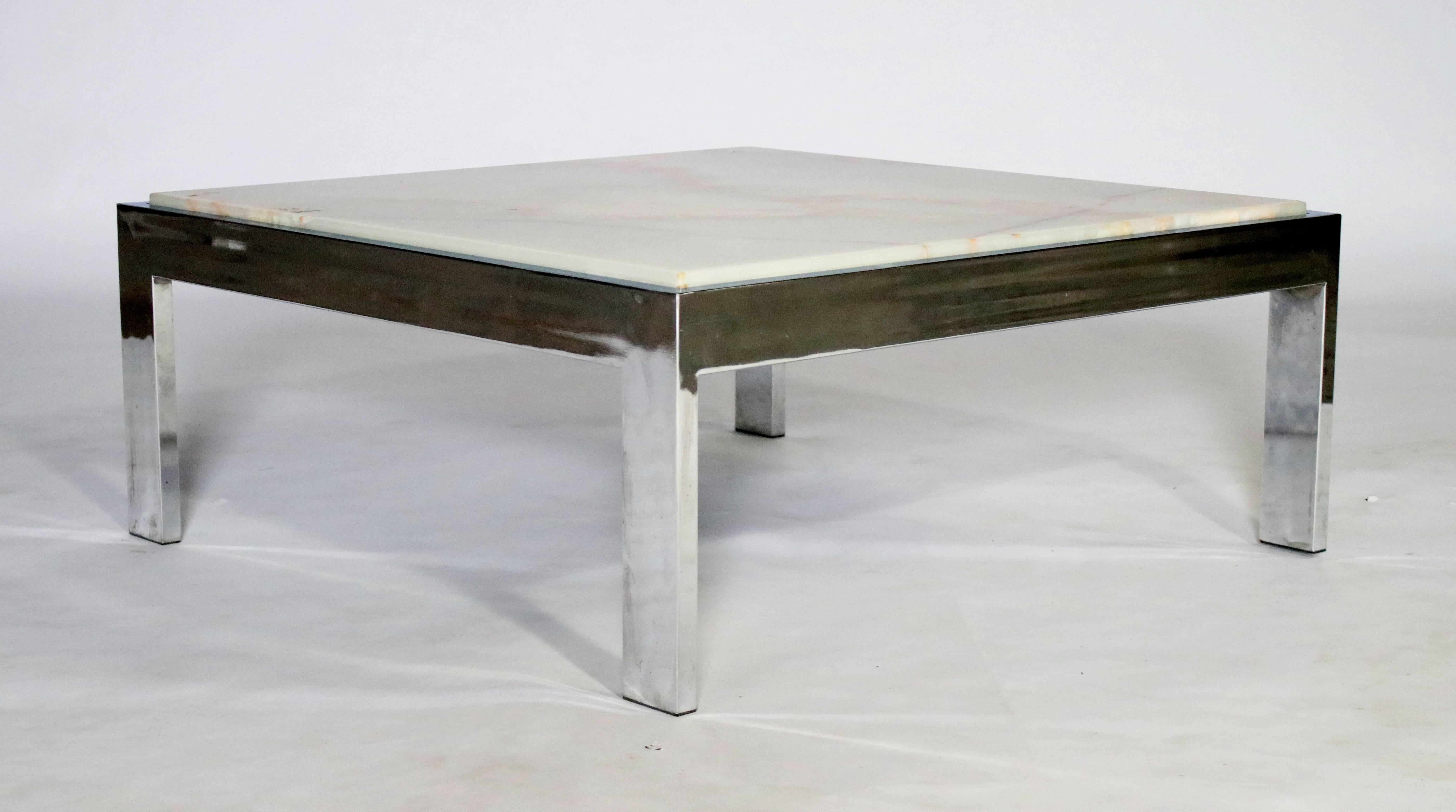 Large square polished chrome steel frame cocktail table with a removable white and gold marble top.