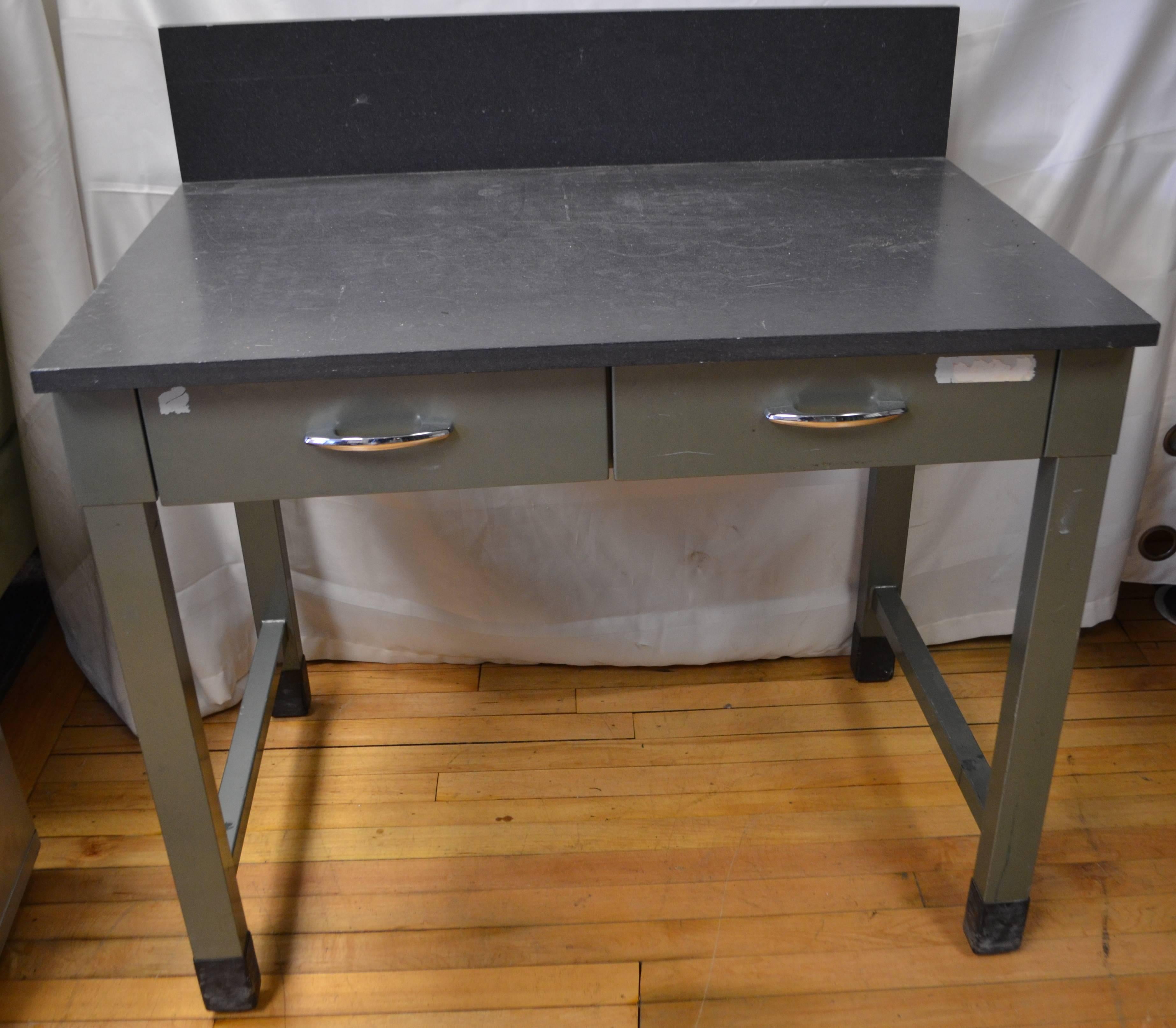 Mid-Century steel desk with two-drawer and as-found slate top and back splash. Trim, sleek and easily fit in entranceway, hallway, room corner, kid's bedroom.