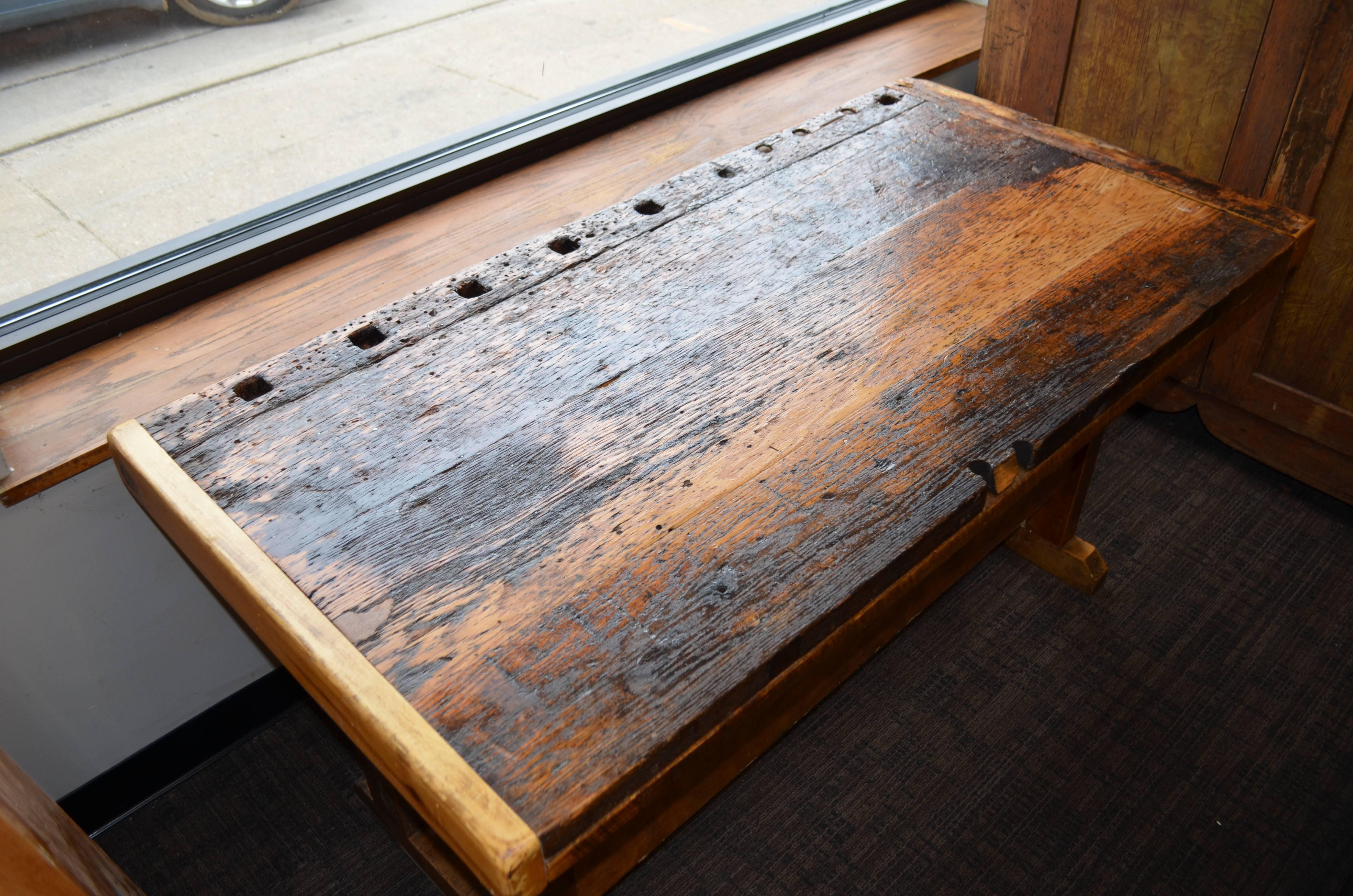 Late 19th century, primitive wooden workbench with character, sturdiness and wonderful patina of use and wear. Side board, left-facing has been replaced. All other elements are original. Bench has been cleaned and sealed. Add a shelf beneath and
