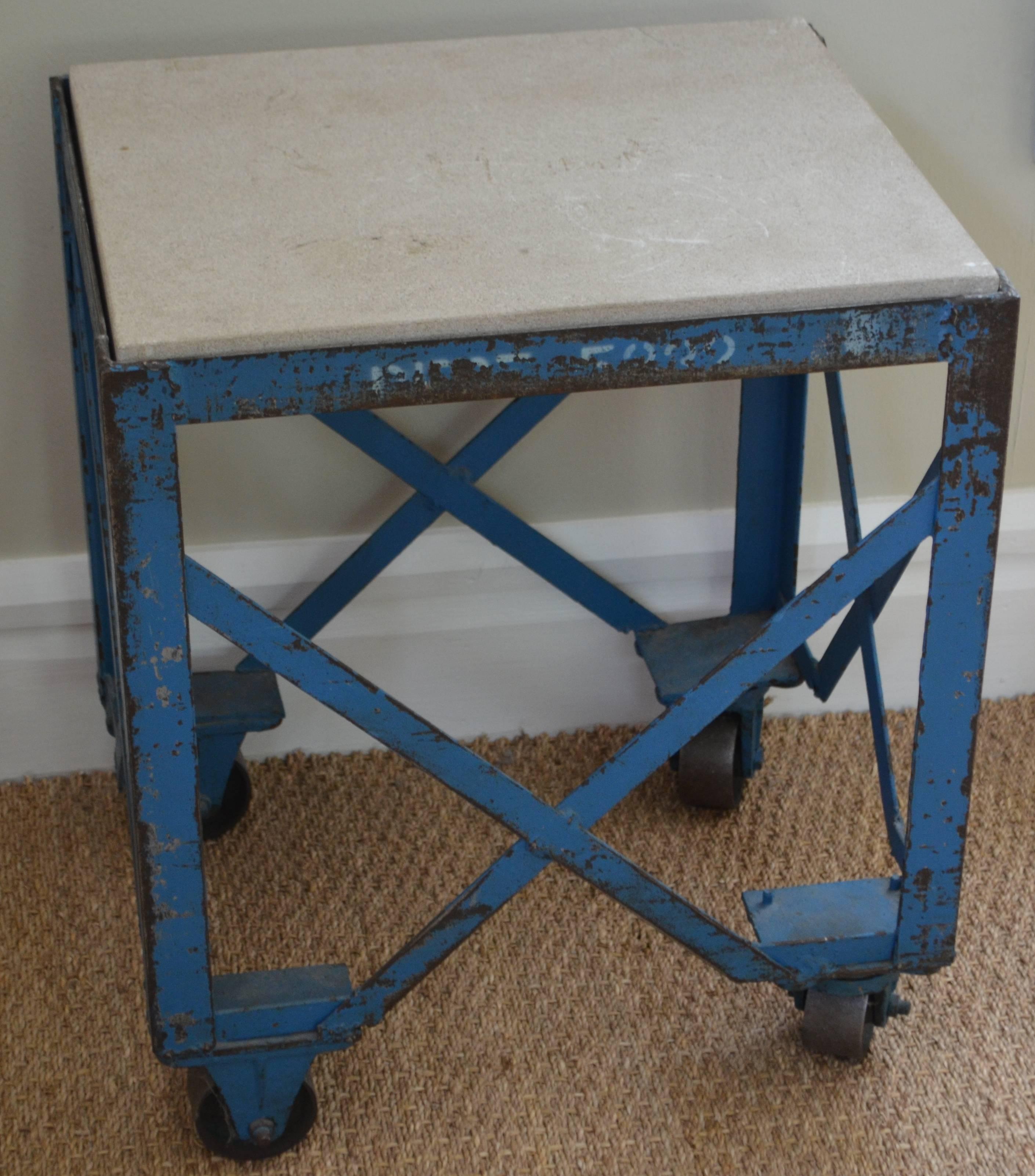 Vintage Industrial table in worn factory blue paint with wheels and fabricated concrete top that's 1.75 inches thick. Cleaned and sealed and perfect as end table, between sofa chairs, end of sofa, lamp table, porch, patio.