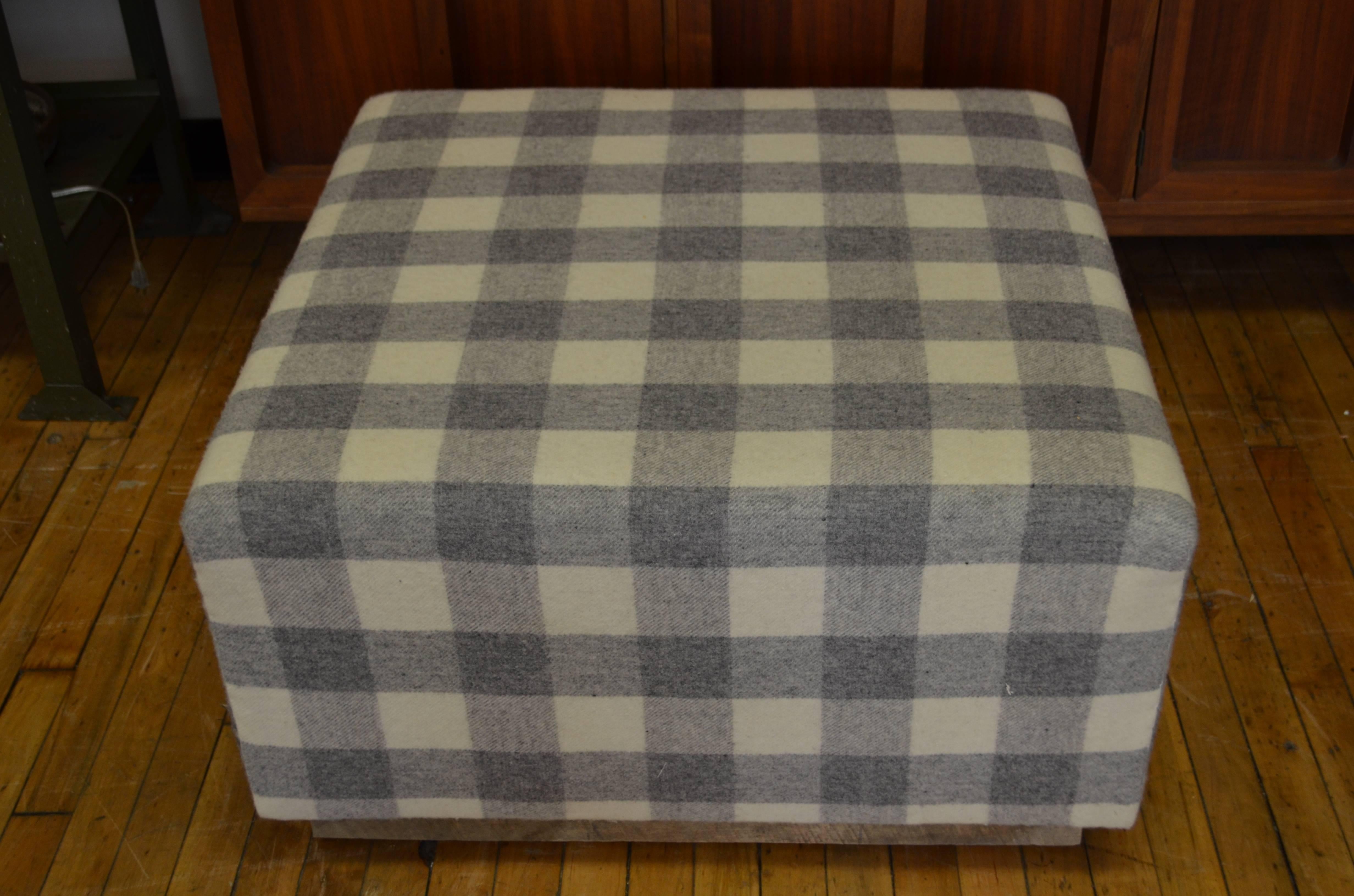 Ottoman upholstered in vintage woolen blanket mounted on barn board wood base. Newly upholstered by a Parisian-trained upholsterer. Note the blanket stitch on corners in the sidebar photo. Soft on the eyes and to the touch. Warm. Sophisticated.
