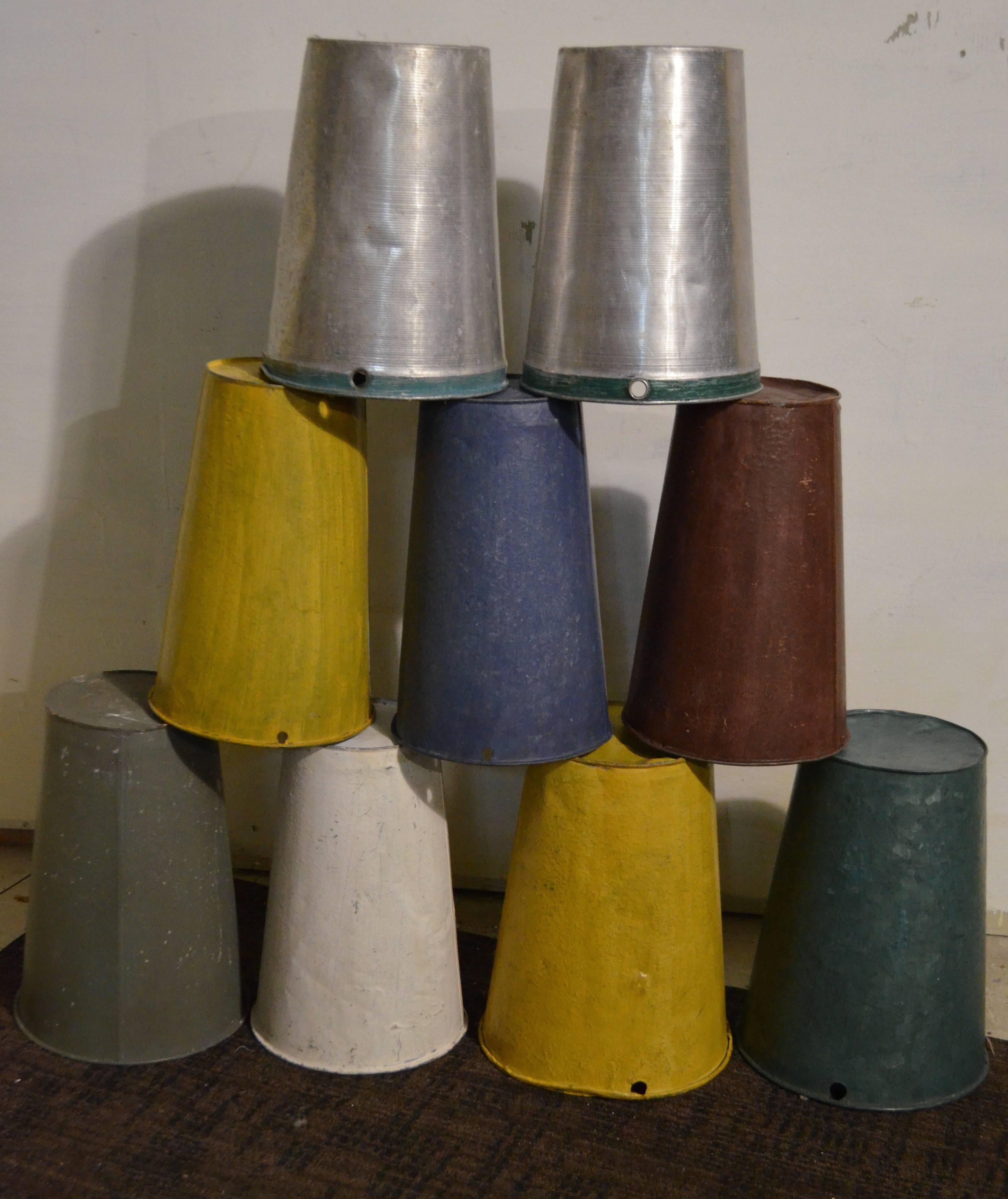 Vintage Canadian sap buckets in aluminum and galvanized steel. Collection of nine in various painted colors. Ideal holiday gifts. Takes care of a number of friends on your list. Buckets are from the 1950s and have been more recently painted.