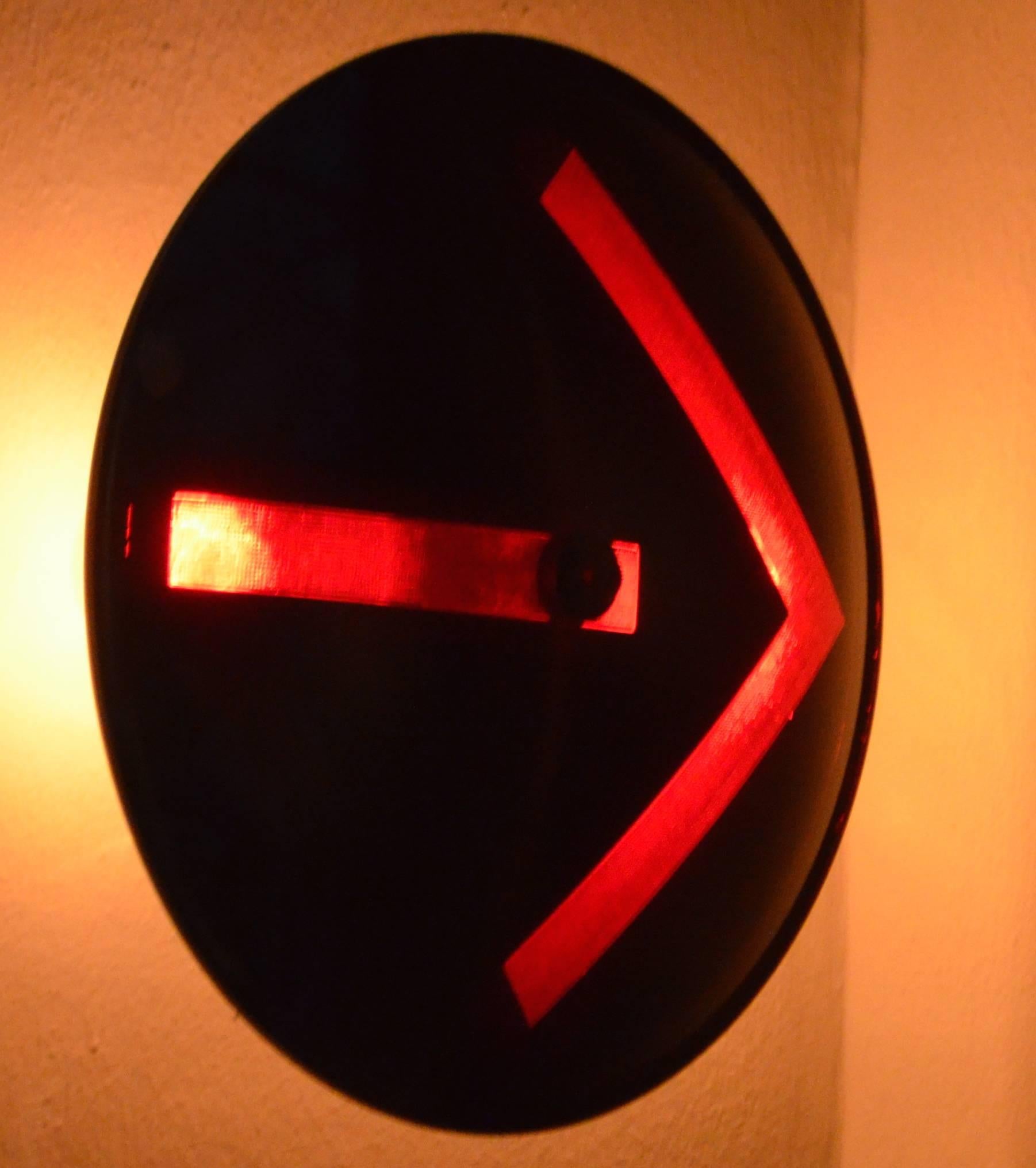 Traffic signal light, turn-arrow Directional's of glass made into a wall sconce. Never-used lens from Kopp manufacturing available in caution yellow, no-turn red, go-ahead-and-turn green, which is actually blue glass that projects green when lit.