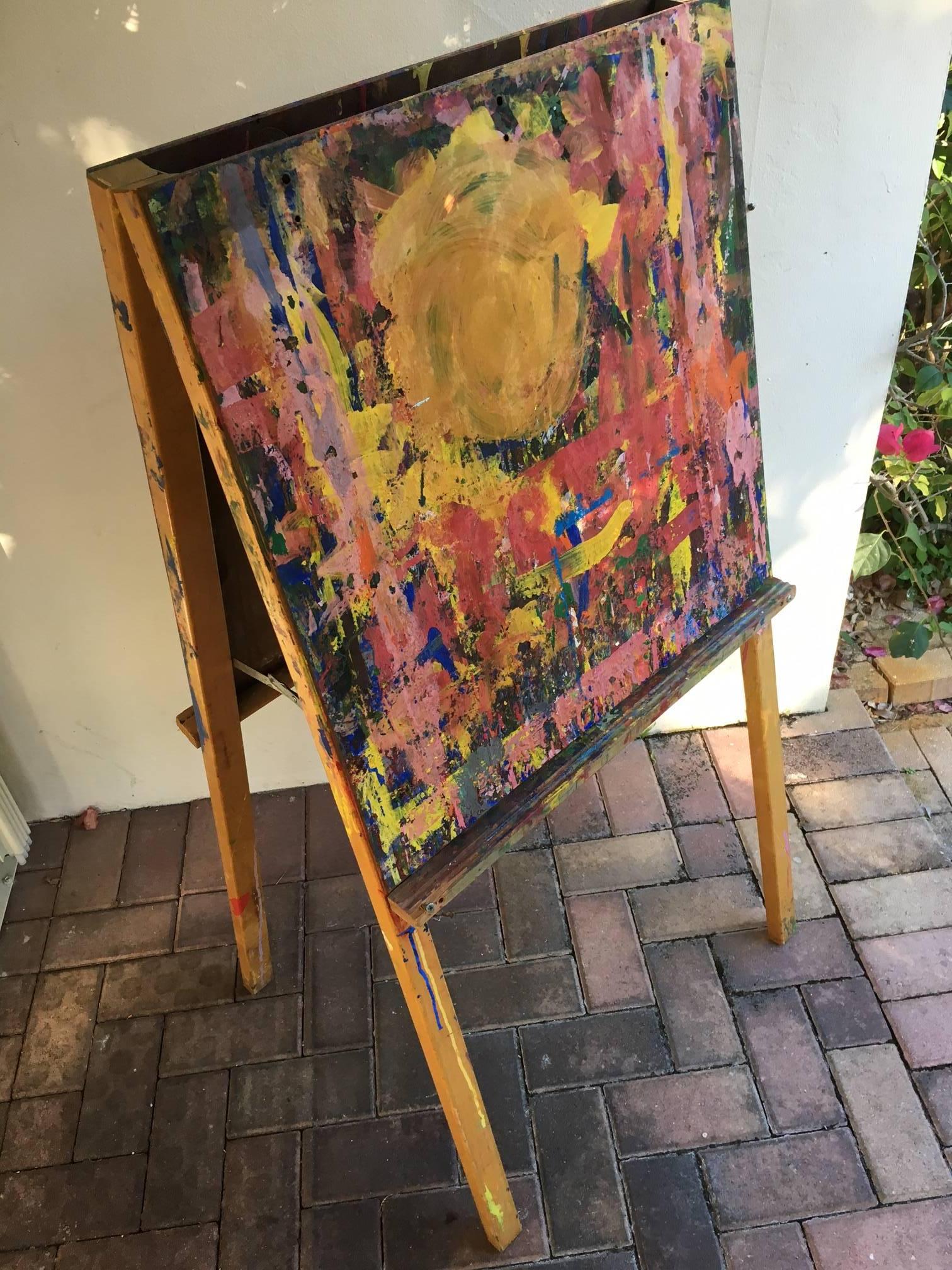 Double-sided art easel from an elementary school in Maine that became a painting in itself at the hands and brushes of the young, aspiring artists who worked at it.  