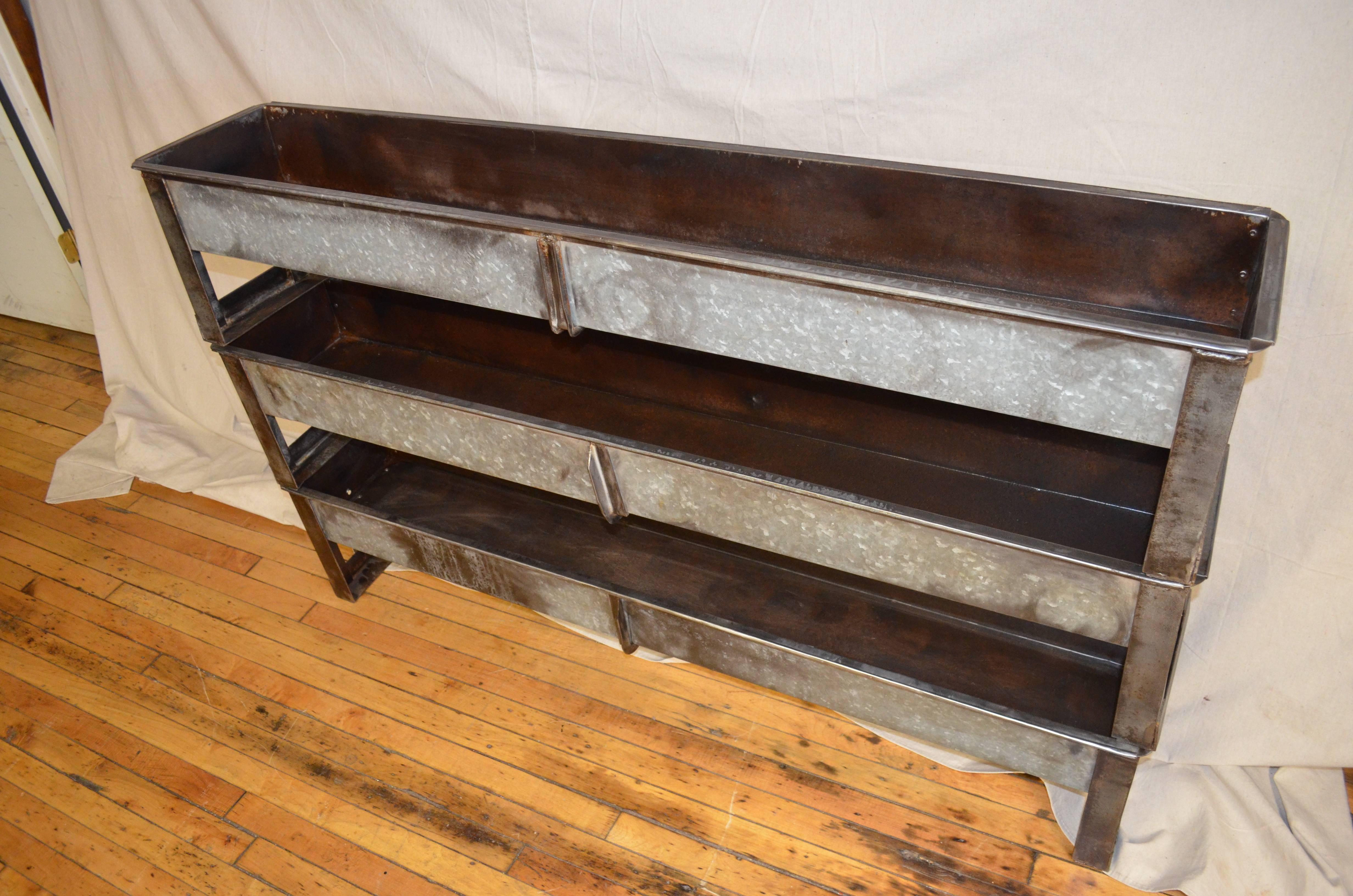Planter from a fox feeder of galvanized steel with steel leg brackets. Planter has been cleaned and sealed and finished to a rich, mahogany patina. Solid, sturdy and ideal for spring floral design and plantings, herb garden, tomatoes, peppers and