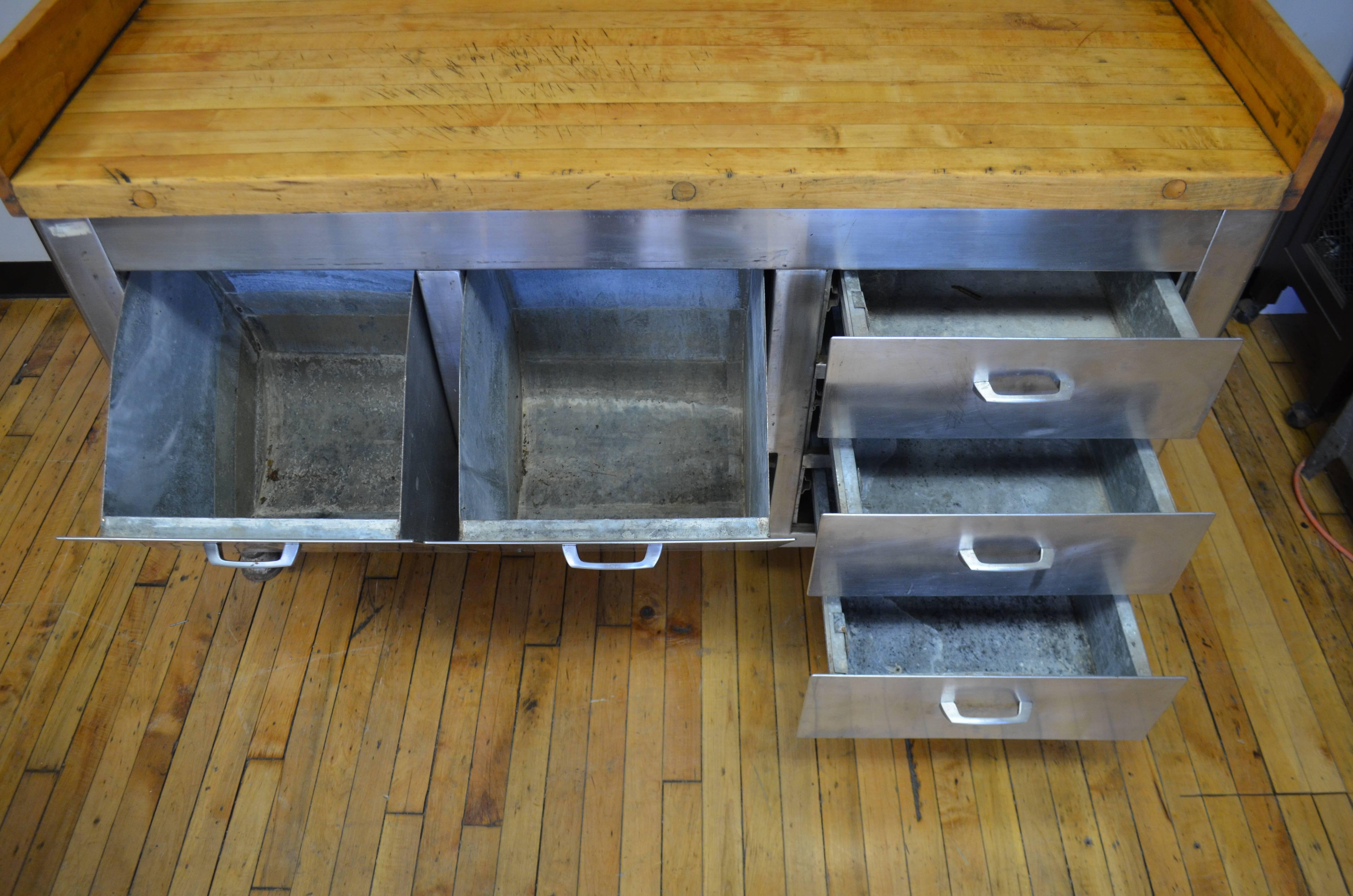 Kitchen Island with butcher block top and solid steel base, circa 1930. This extraordinary piece was used in large-scale institutional food prep. Its 2.25