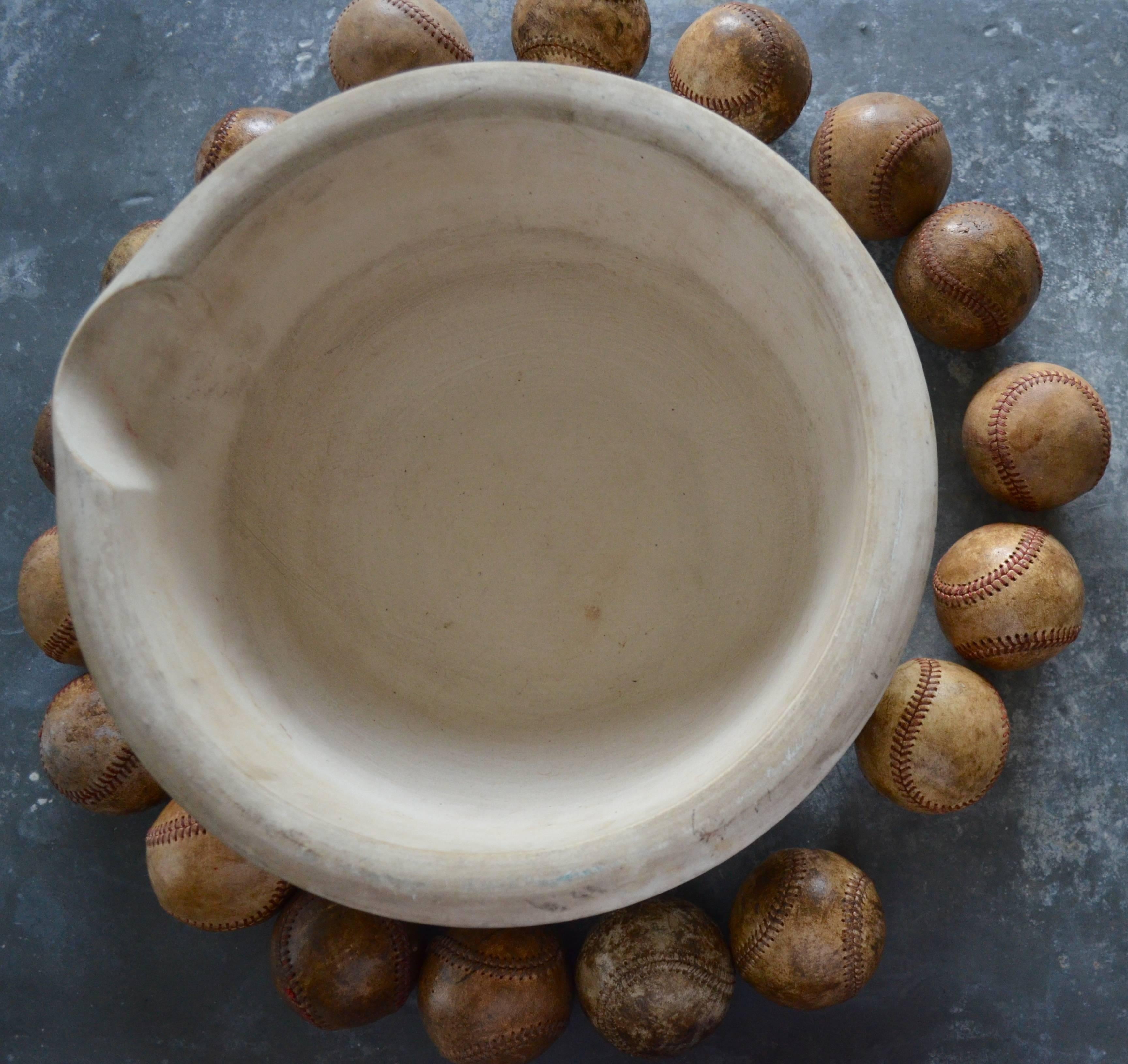 20th Century Mortar Bowl of Antique Stone with Display of Well-Worn Baseballs