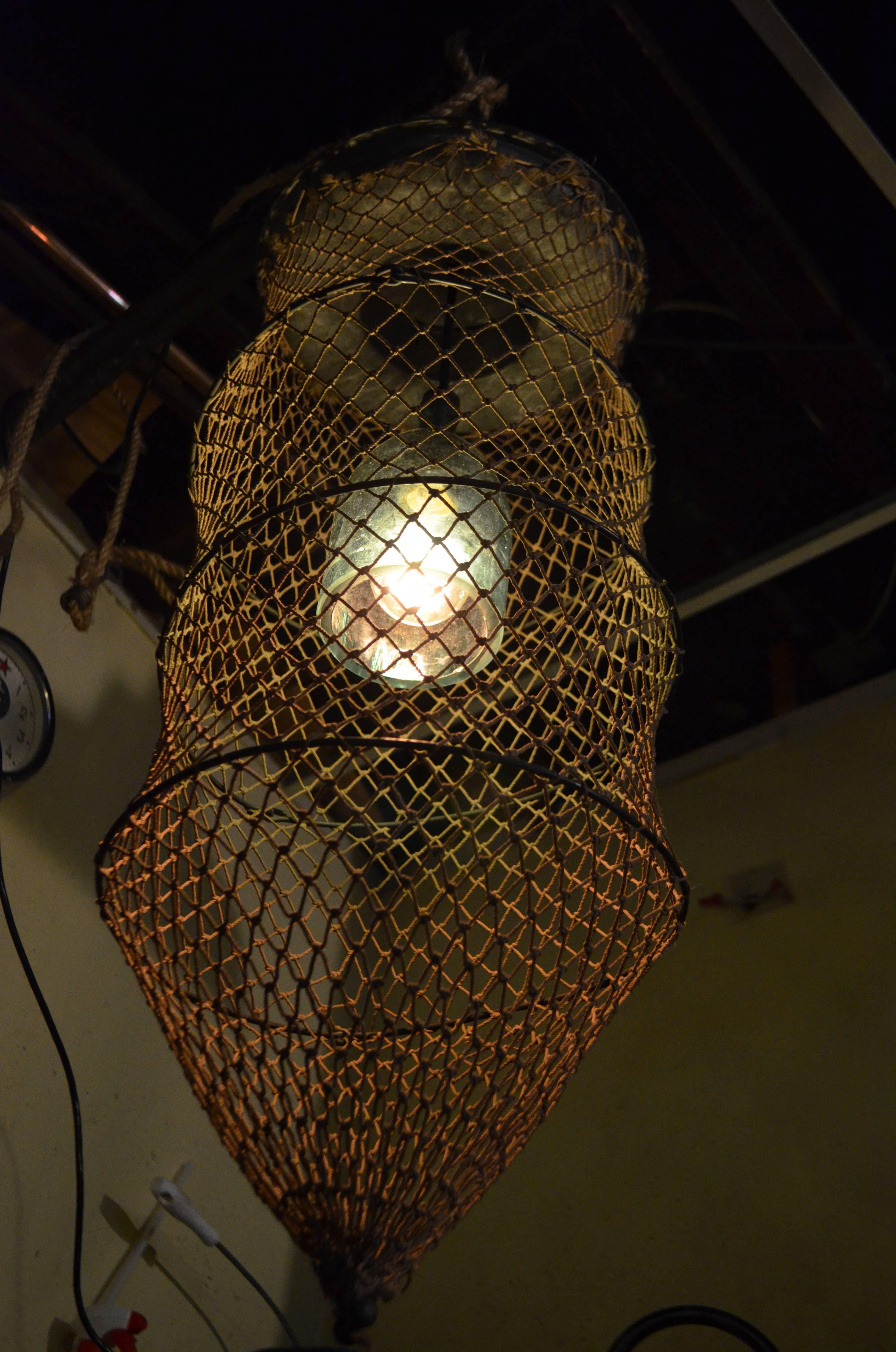 Glass Pendant Light from Seltzer Bottle Mounted Inside Fish Trap