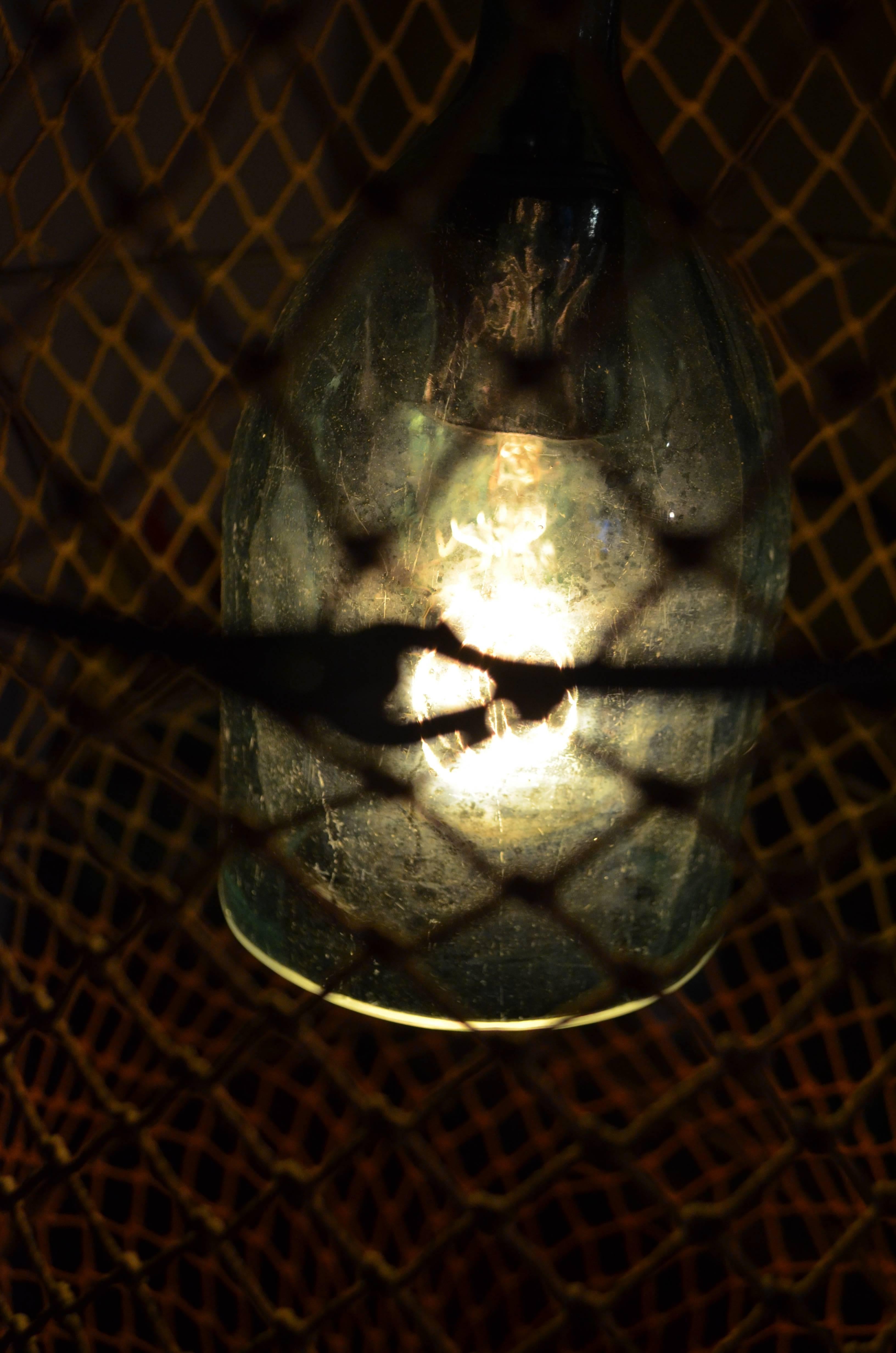 Pendant Light from Seltzer Bottle Mounted Inside Fish Trap 1