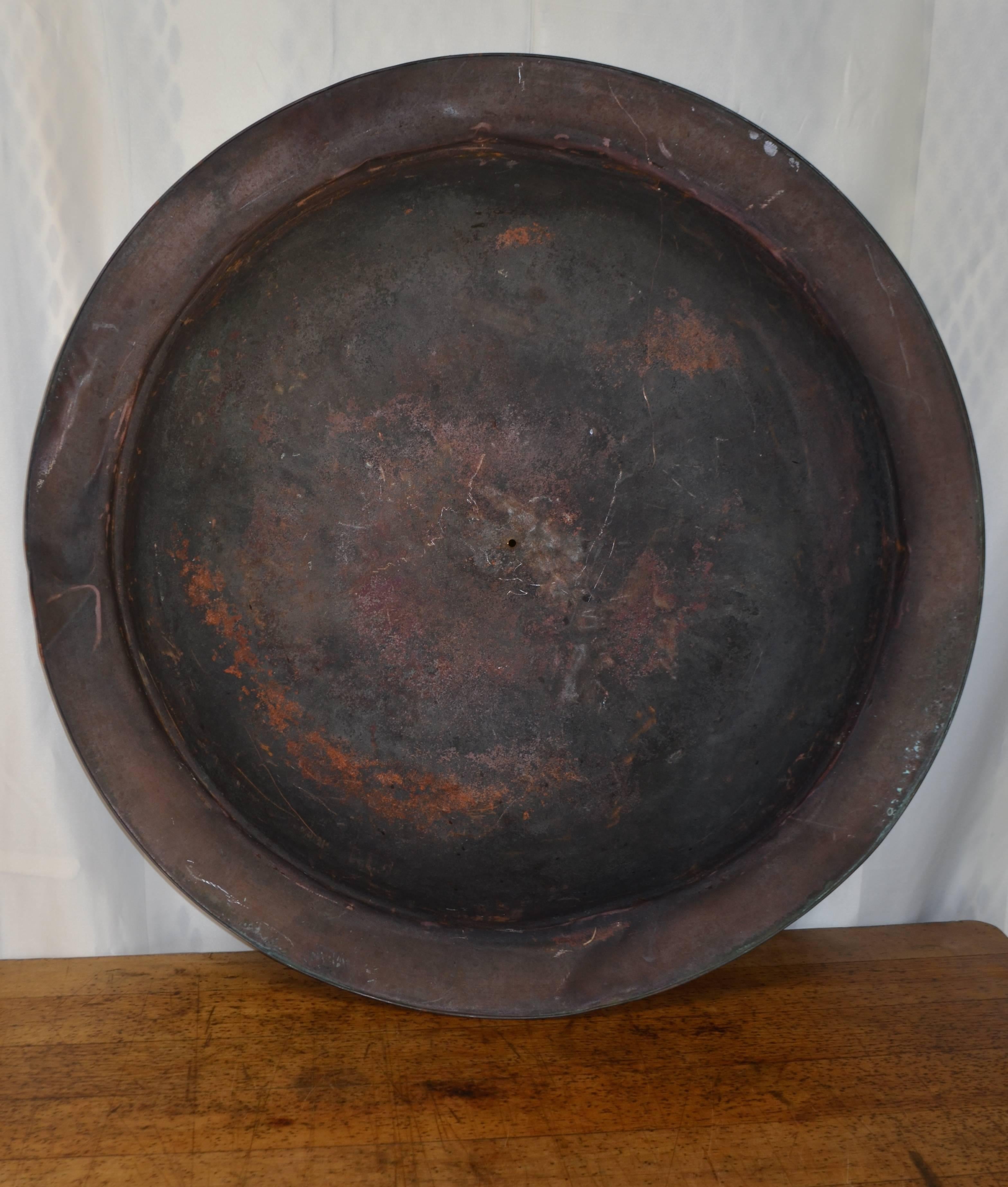 Copper disc makes compelling wall art. Mounts concave or convex. Concave side pictured above has been sealed with lacquer and displays a wrinkled, richly dark chocolate patina. Tactile yet smooth. Very intriguing to touch and to behold. One of those