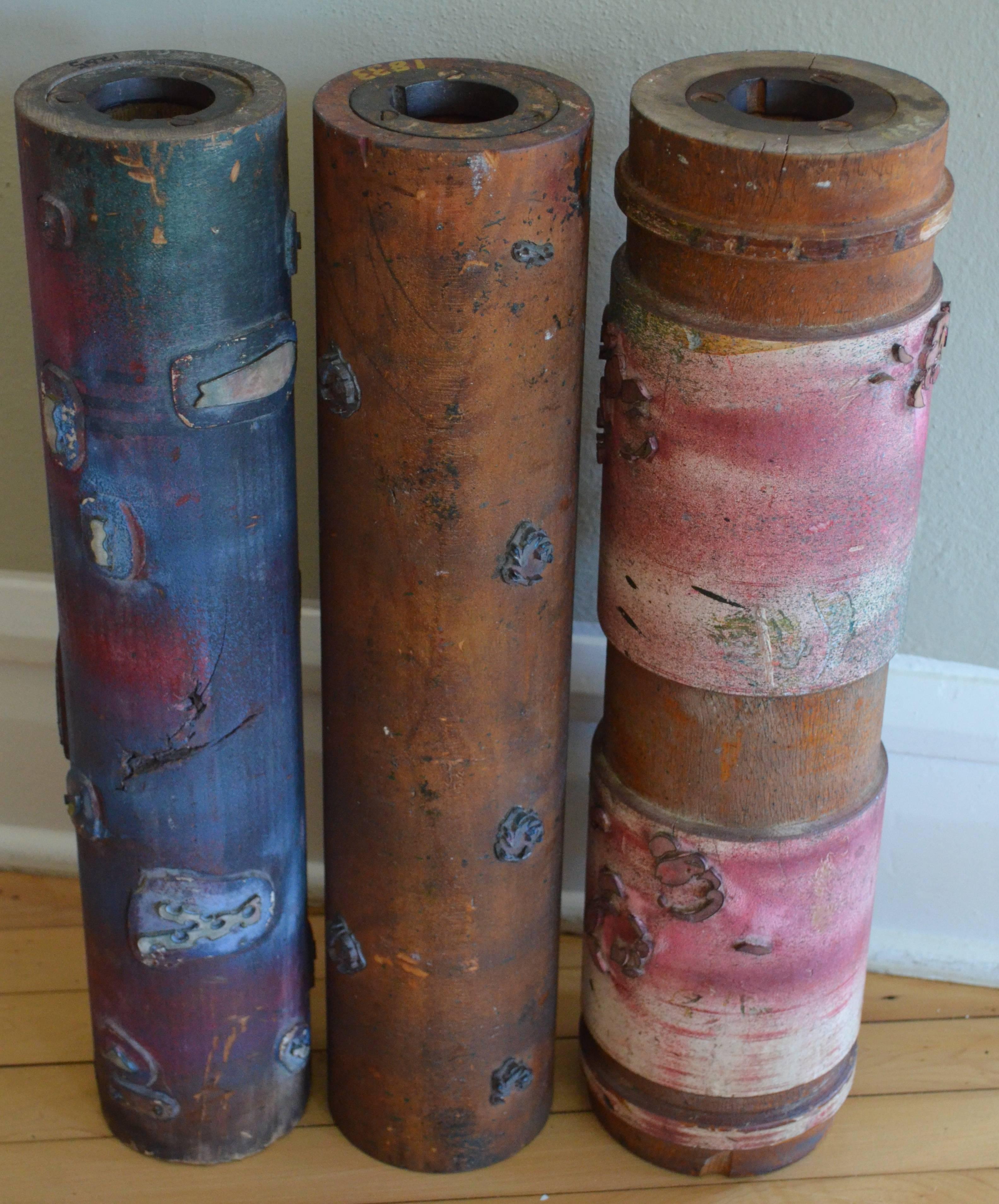 Printing rollers (set of three) fashioned from old growth mahogany or maple used to print wallpaper. Dating back to the early 1900s, these rollers were fitted out with brass filigrees hand-cut to the wallpaper pattern filled in with ink pads. The