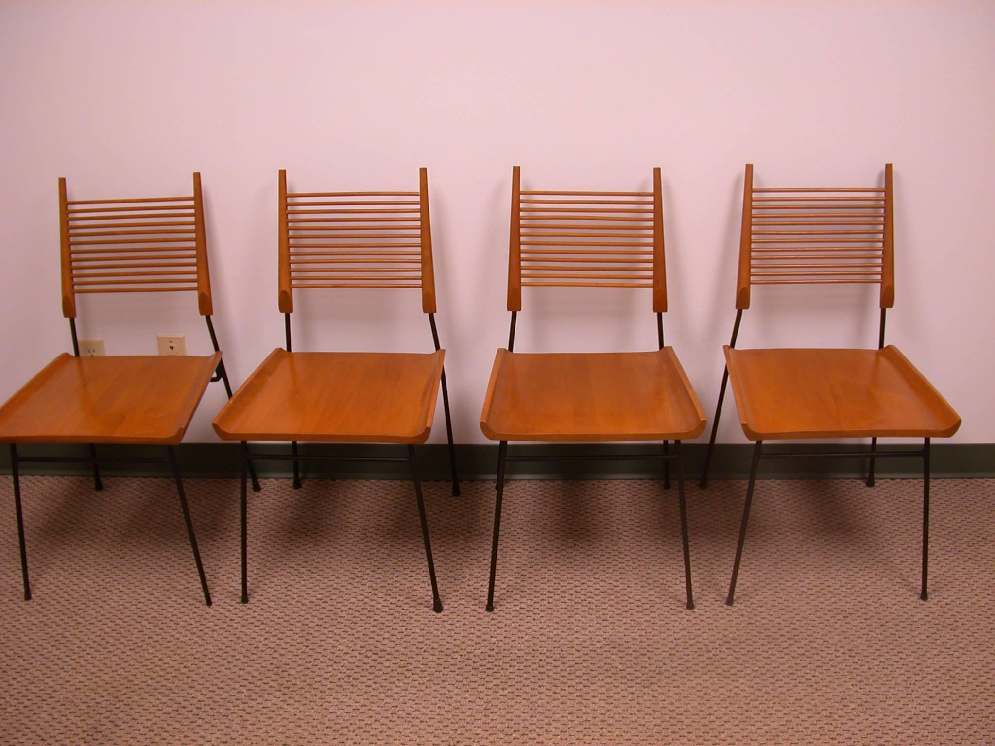 1950s Paul McCobb-designed planner group dining table set and four chairs. McCobb was arguably responsible for the introduction of modern design into middle-class American households if for no other reason than that he designed the 1952 set for the