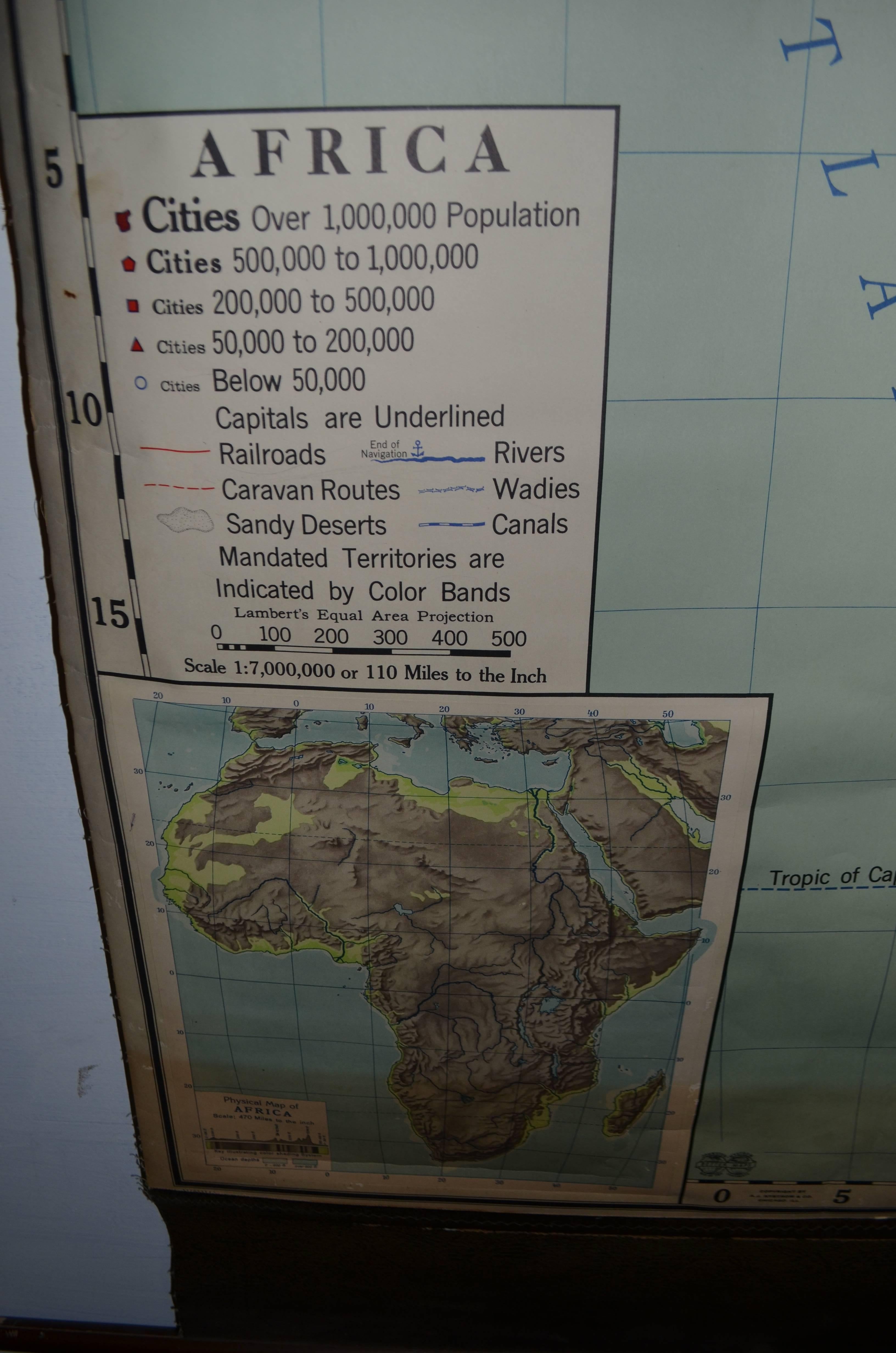 Map of Africa, early 1900s, illustrated in fine detail and printed in a soft palette of colors. Mounted on a retractable wooden roller. Represents a time when Africa was largely controlled by European colonial powers.