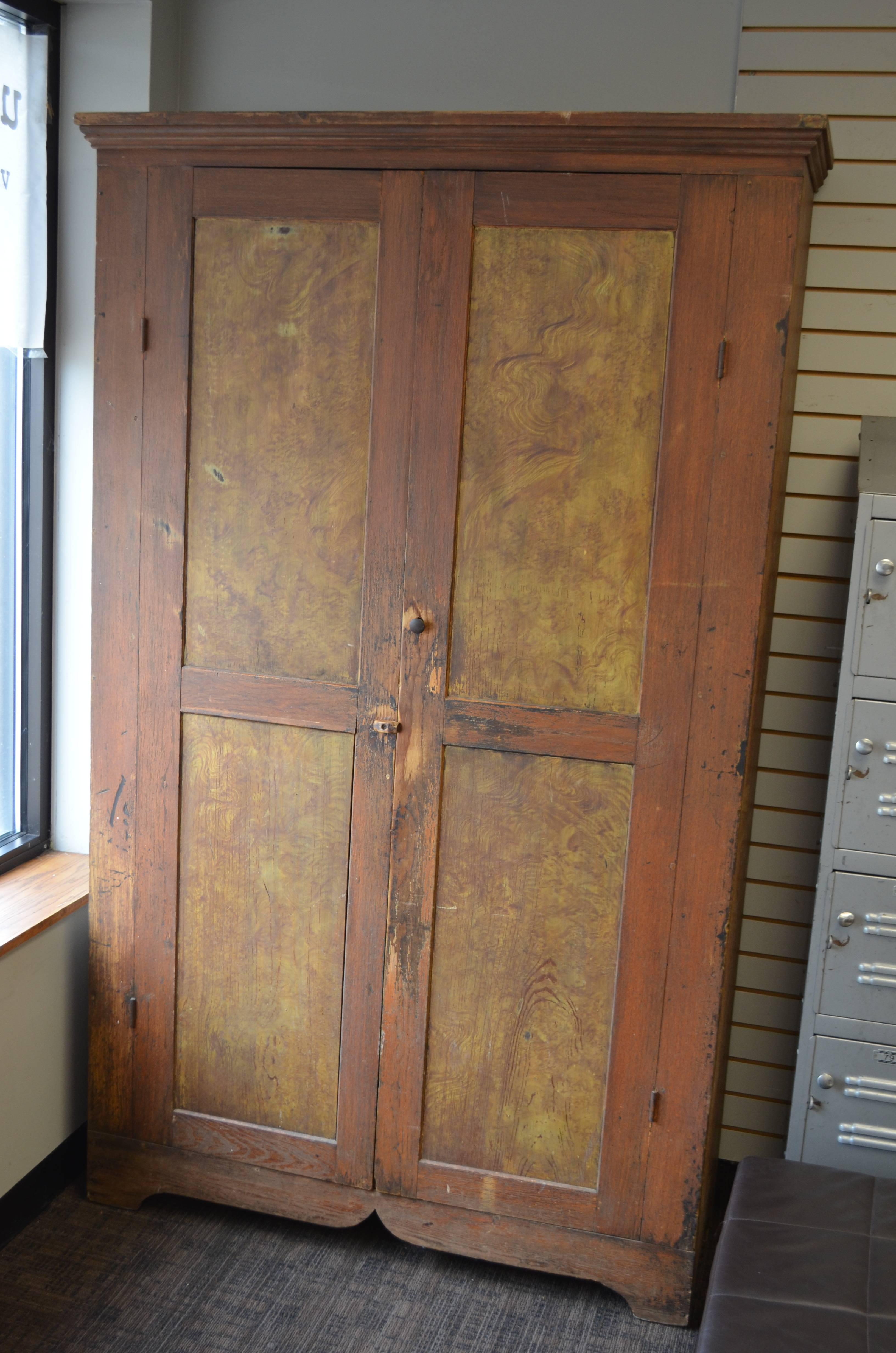 1800s cupboard hand made of ponderosa pine with painted door panels in style of Folk Art. Great storage capacity on five shelves 14.25 inches deep.