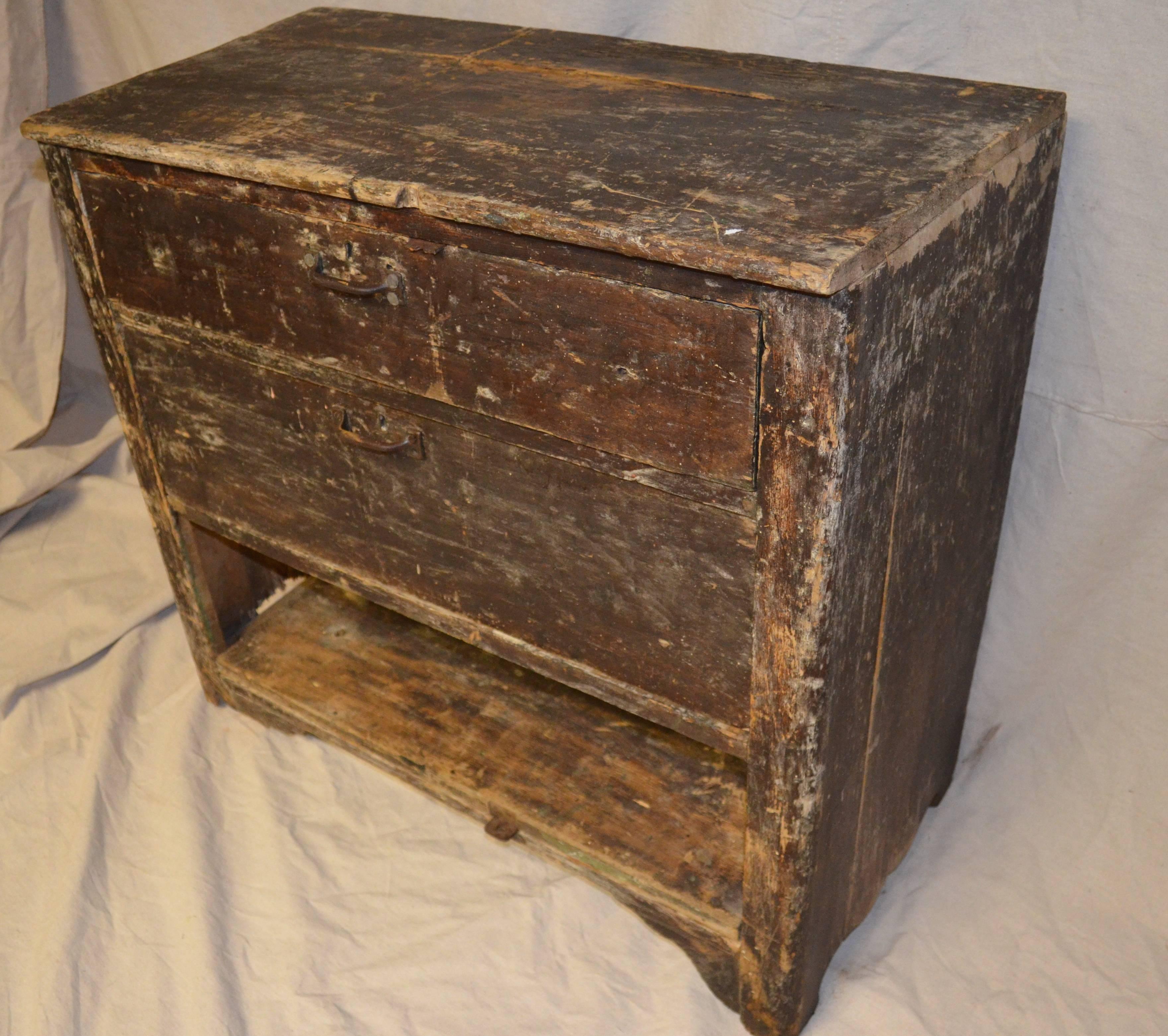 Primitive wooden cabinet with two drawers and bottom shelf. Has been reconditioned, cleaned and sealed. If you're into primitive, you'll love this piece for bathroom, hallway, entranceway, lamp table.