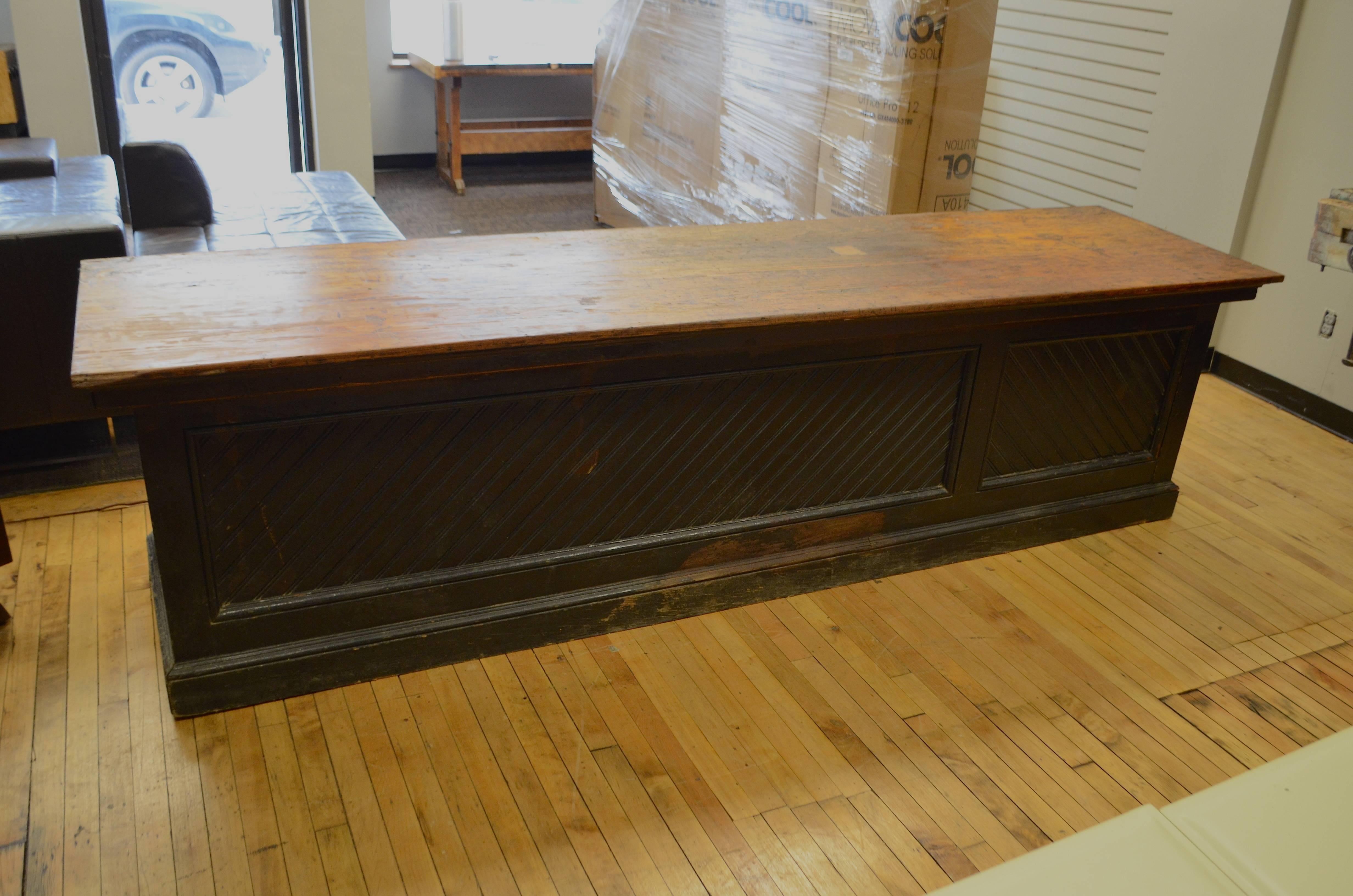 Hardware store counter bar from the late 1800s. Extraordinary piece with historical resonance from the Upper Midwest. Eighteen bins/cubbies on the reverse side held the nails, screws ands bolts that passed across this counter into the hands of the