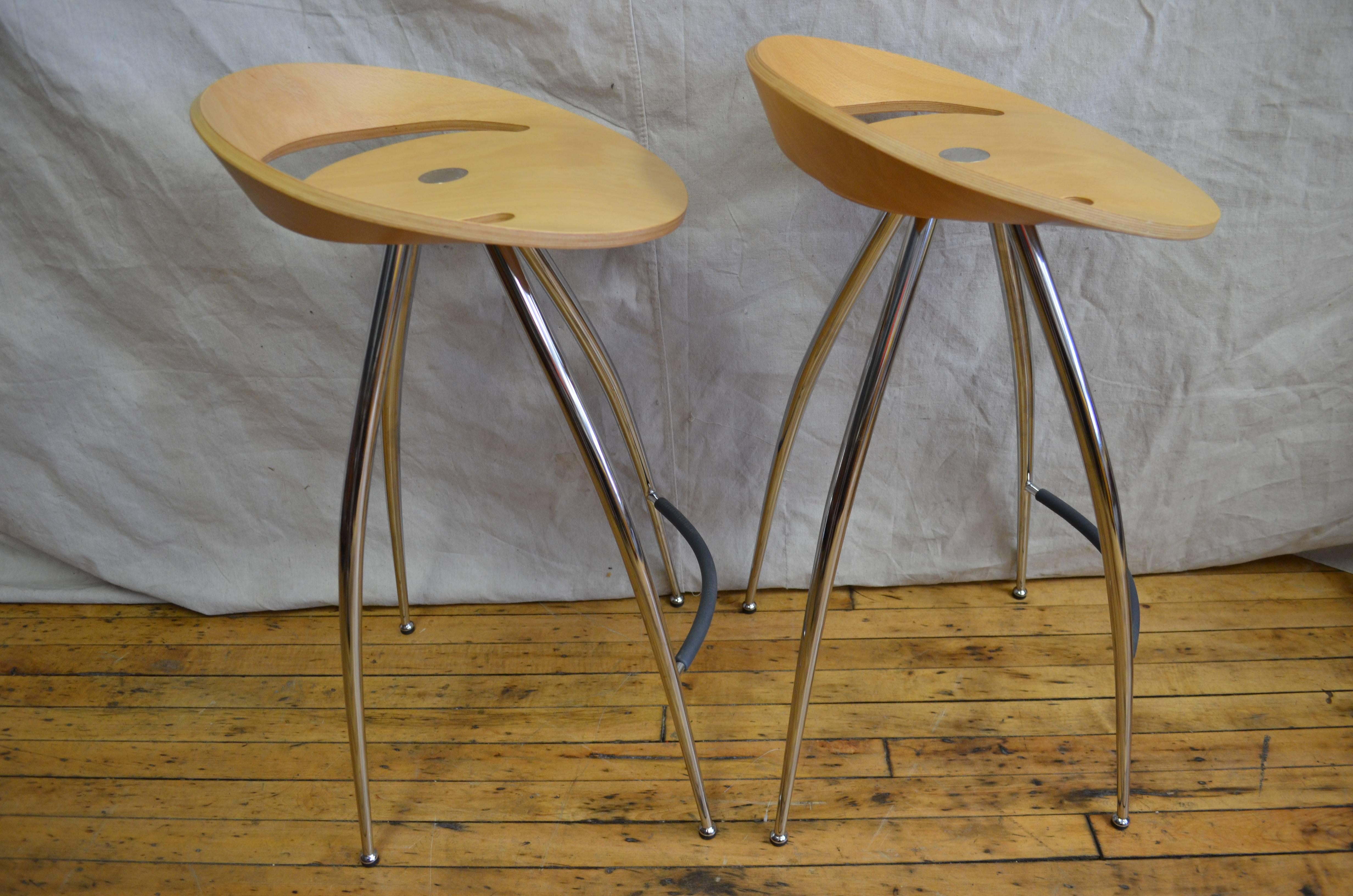 Pair of Lyra stools by Magus design of Italy, distributed through Herman Miller. Medium size with chrome base, beech seat, new feet. Designed by the Milan firm design group Italia 1994, the Lyra stool owes a lot to the way Charles Eames used