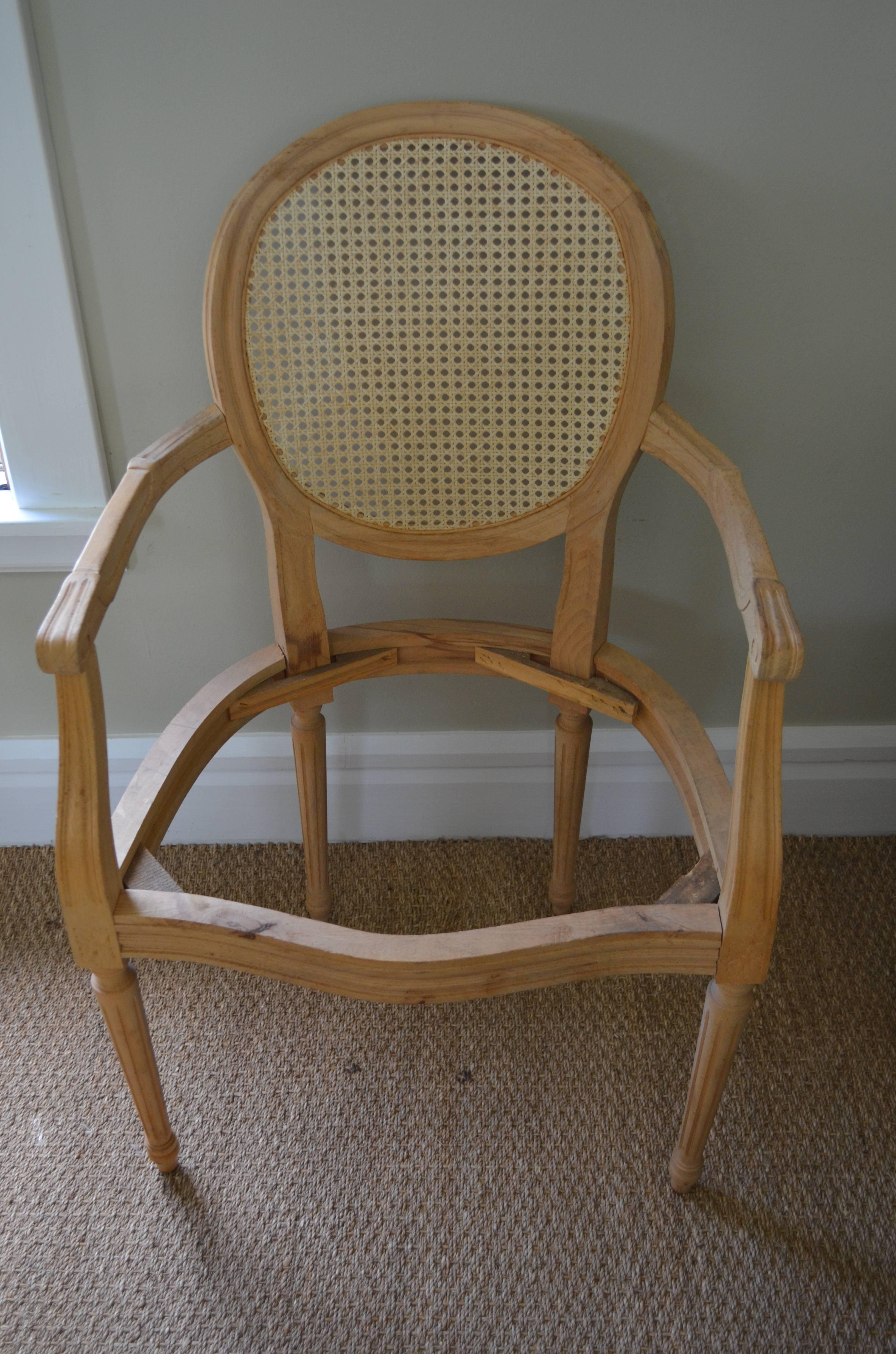 Dining chair for home or restaurant, circa 1950s, 40 available. Constructed by hand with hand-carved detail in French country style. Has been refurbished with new cane back, wood stripped and sanded. Ready for stain or paint and your choice of