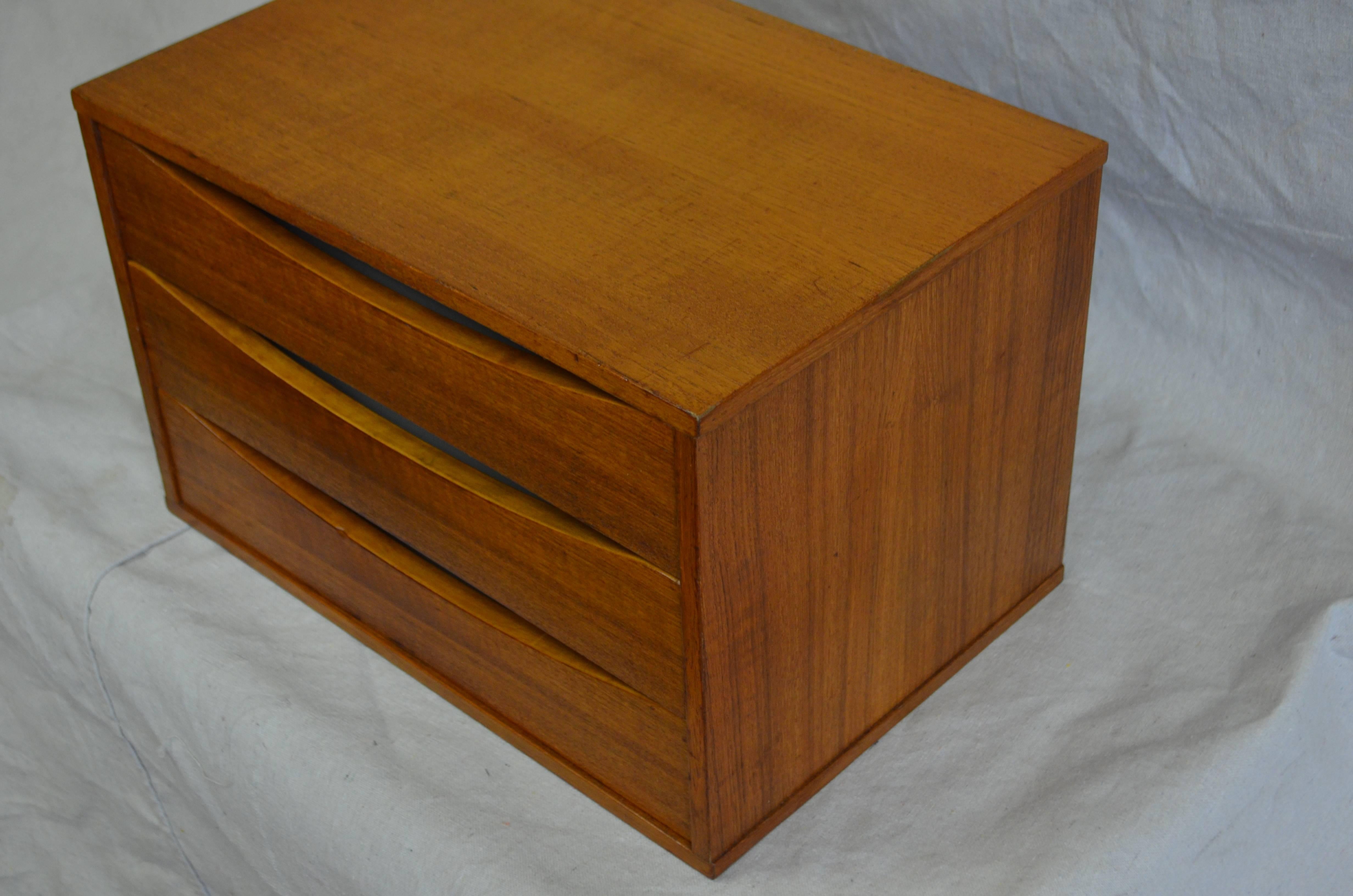 Jewelry box or letter box of teak with three drawers designed by Arne Vodder. Made in Sweden. Sweet, clean-lined, exquisitely-appointed with striking wood grain inside and out.